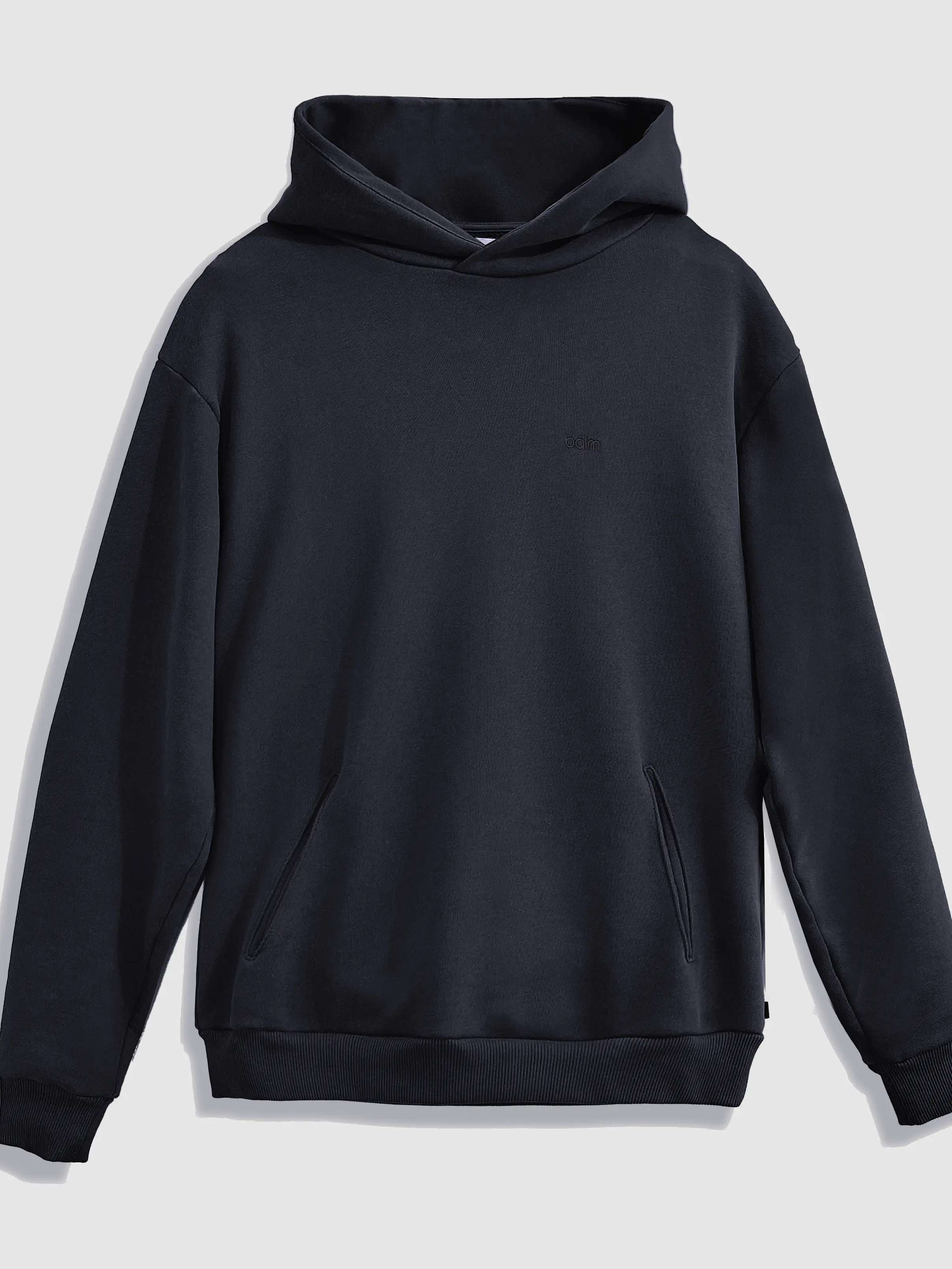 Close-up of a single green leaf against a white background.