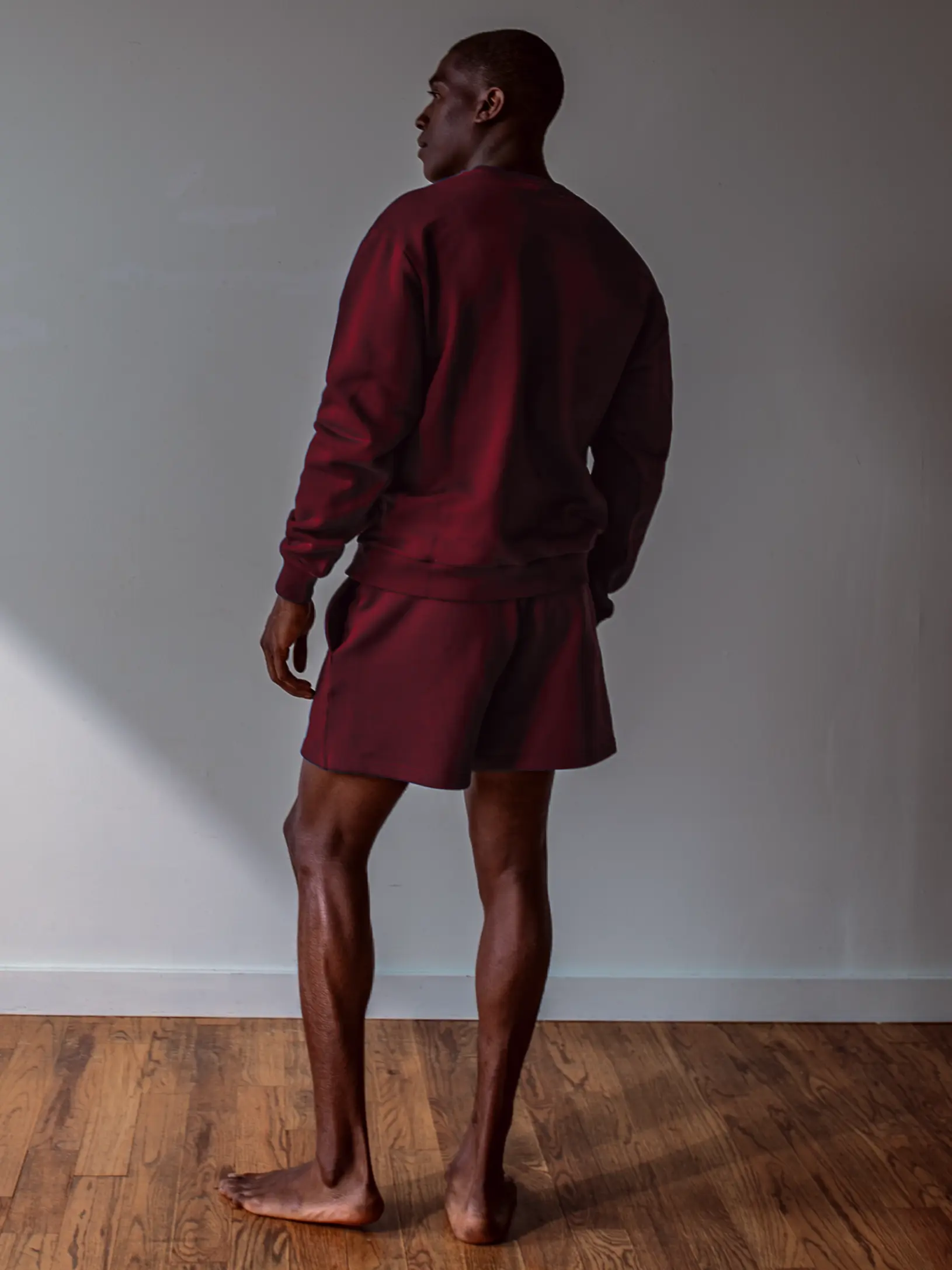 Close-up of a single green leaf against a white background.