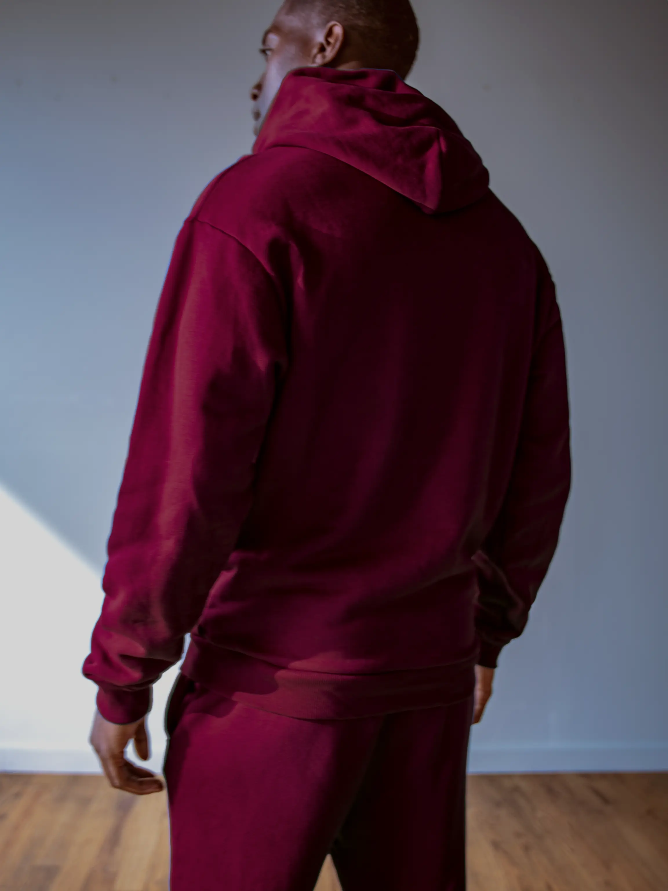 Close-up of a single green leaf against a white background.