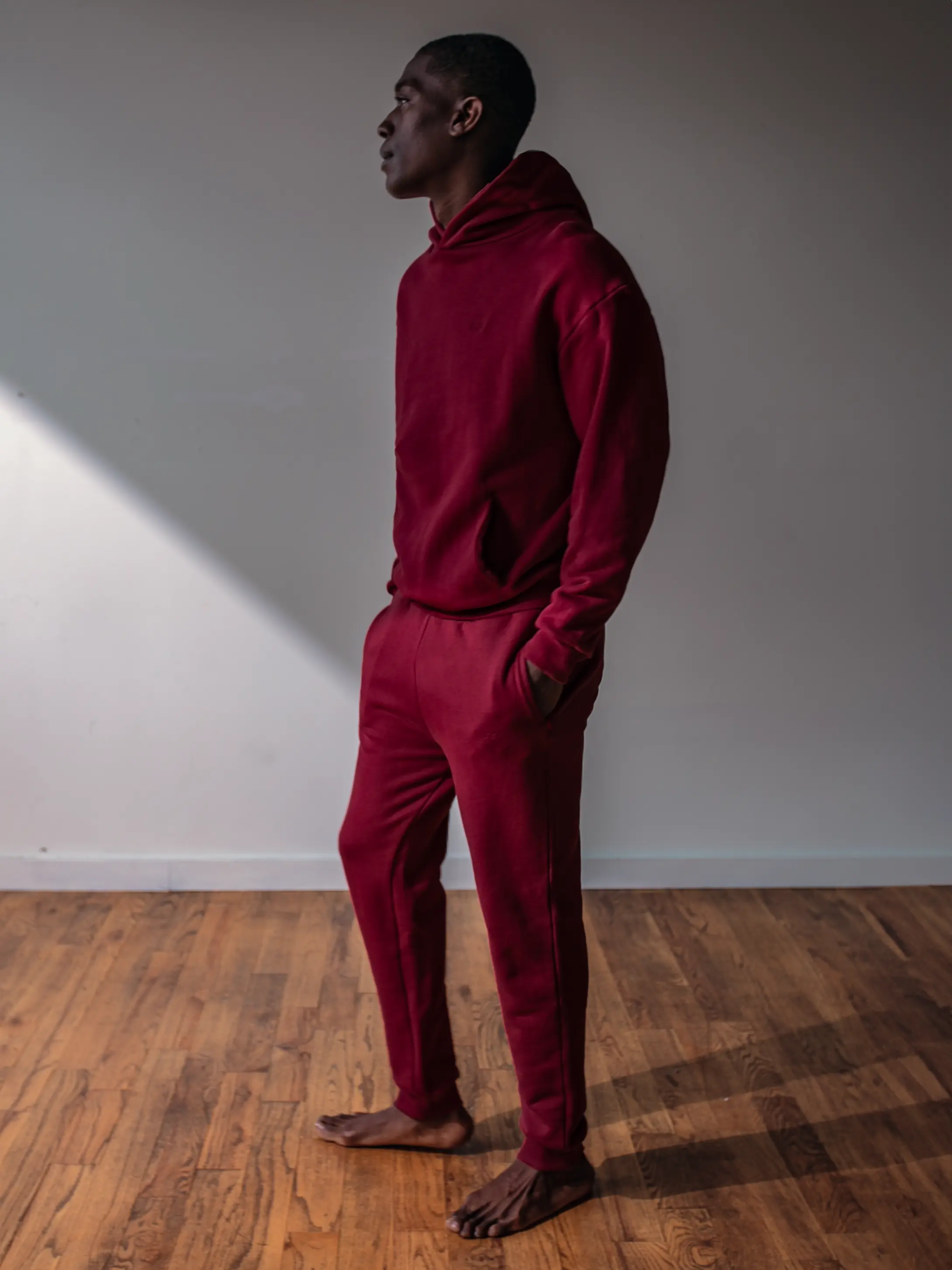 Close-up of a single green leaf against a white background.
