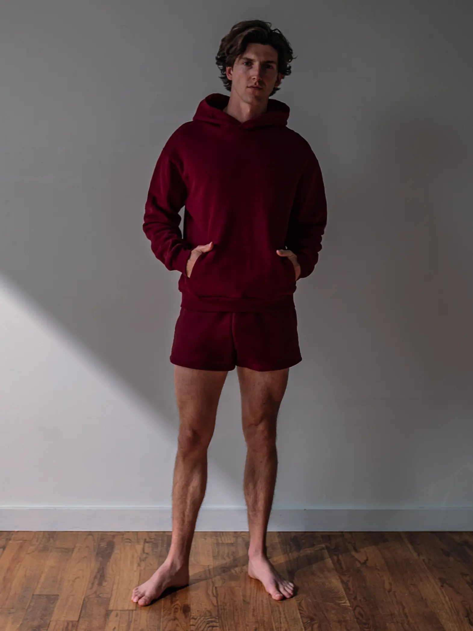 Close-up of a single green leaf against a white background.