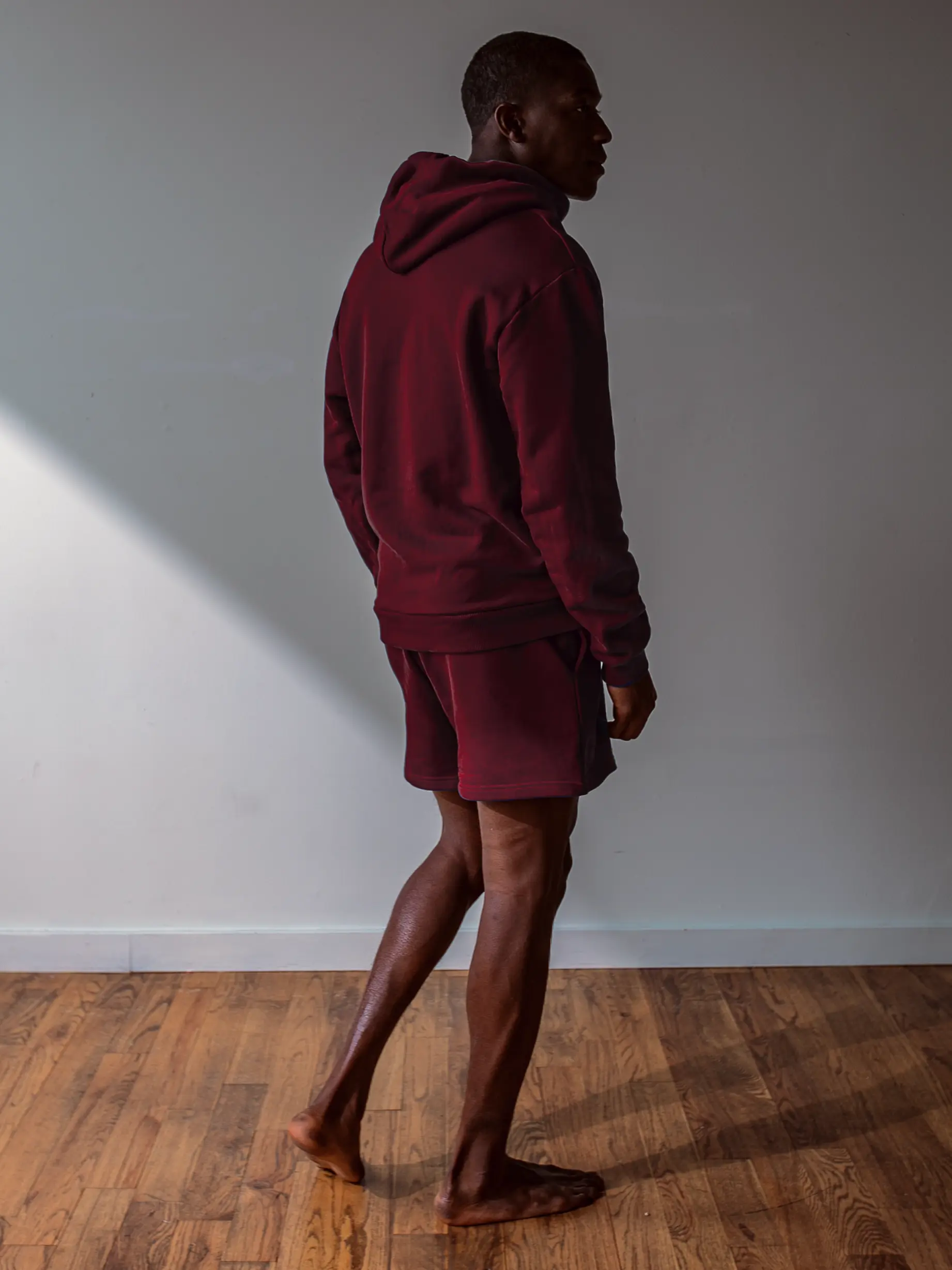 Close-up of a single green leaf against a white background.