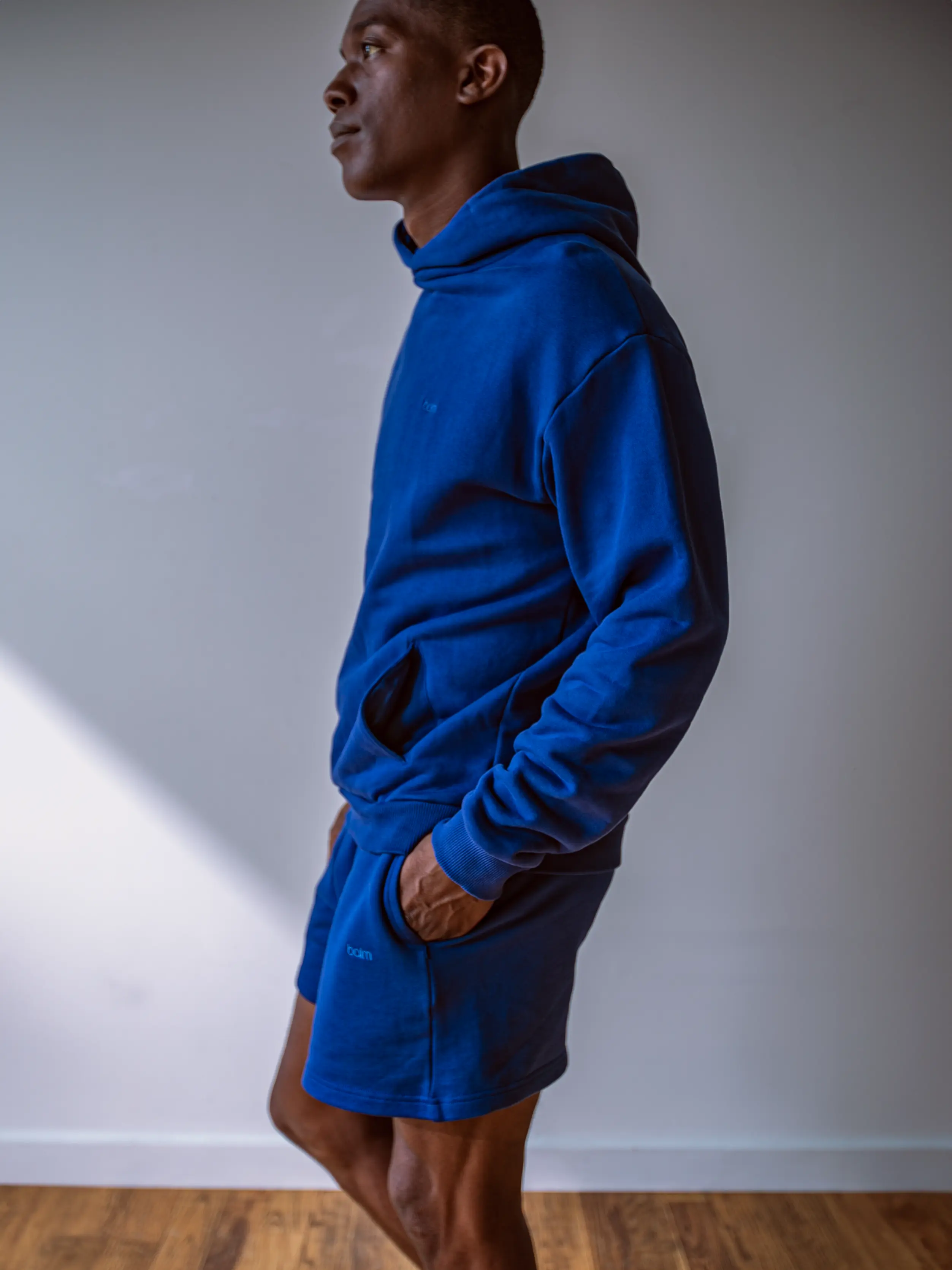 Close-up of a single green leaf against a white background.