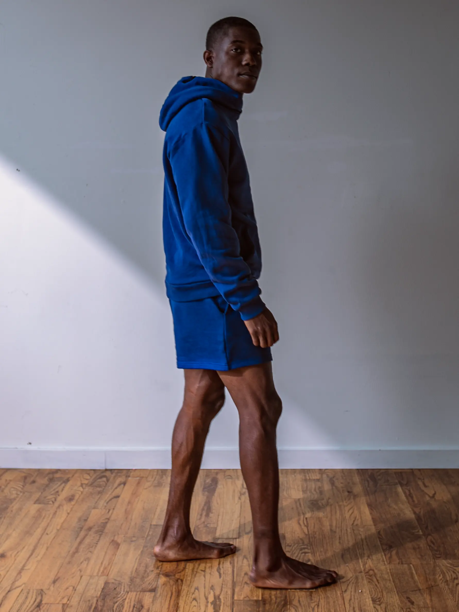 Close-up of a single green leaf against a white background.