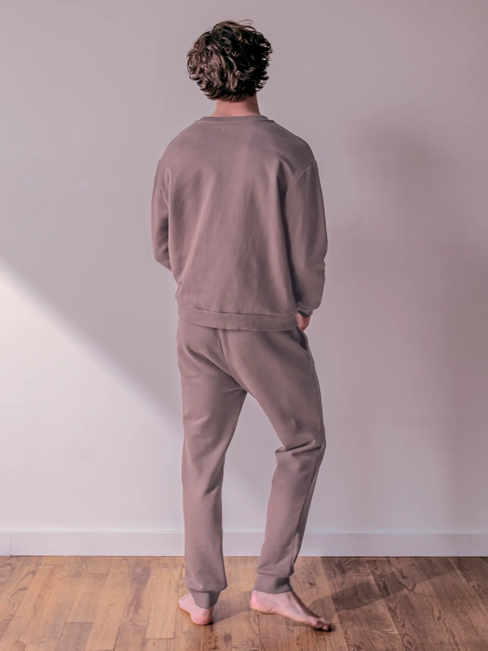 Close-up of a single green leaf against a white background.