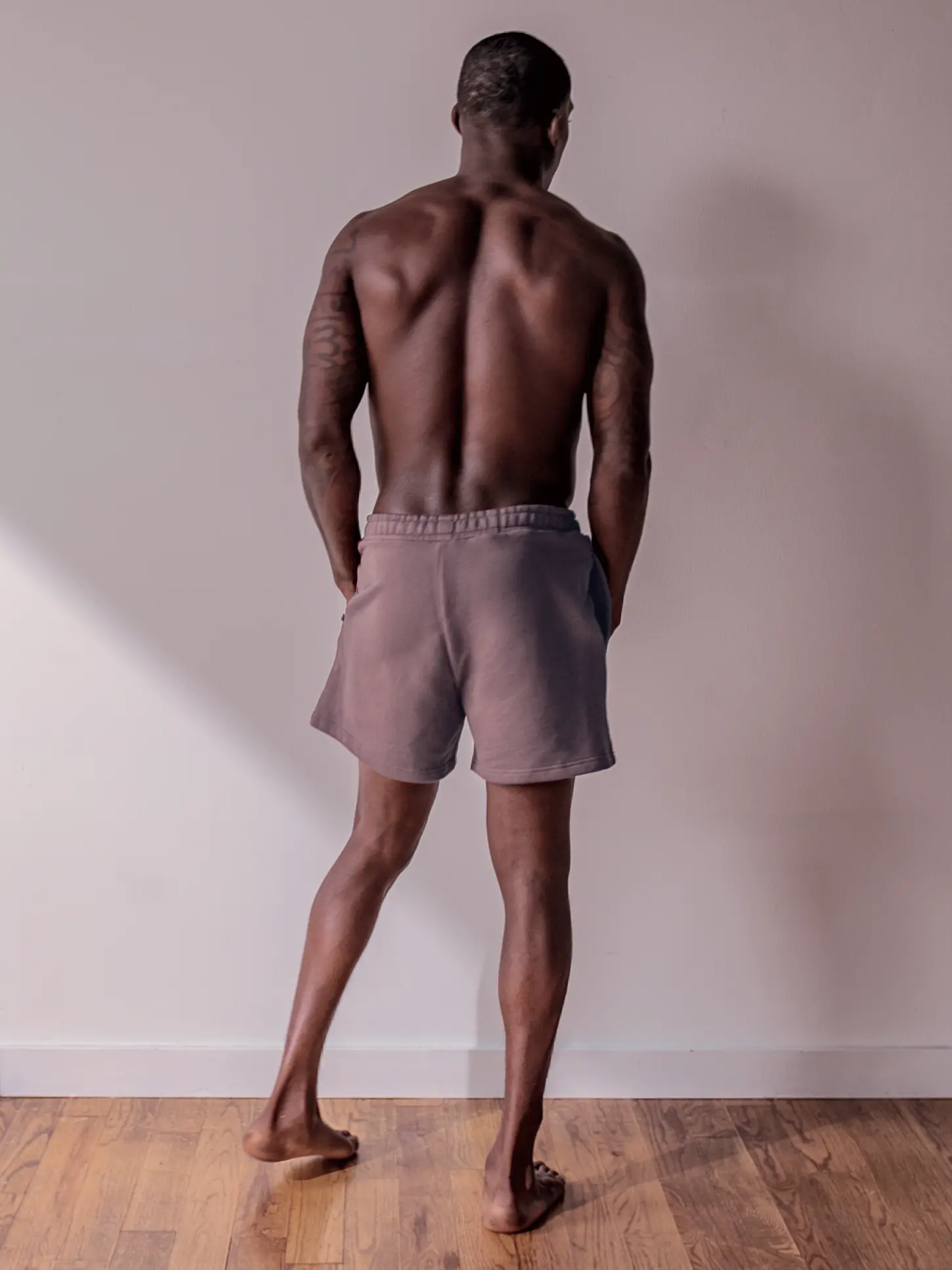 Close-up of a single green leaf against a white background.