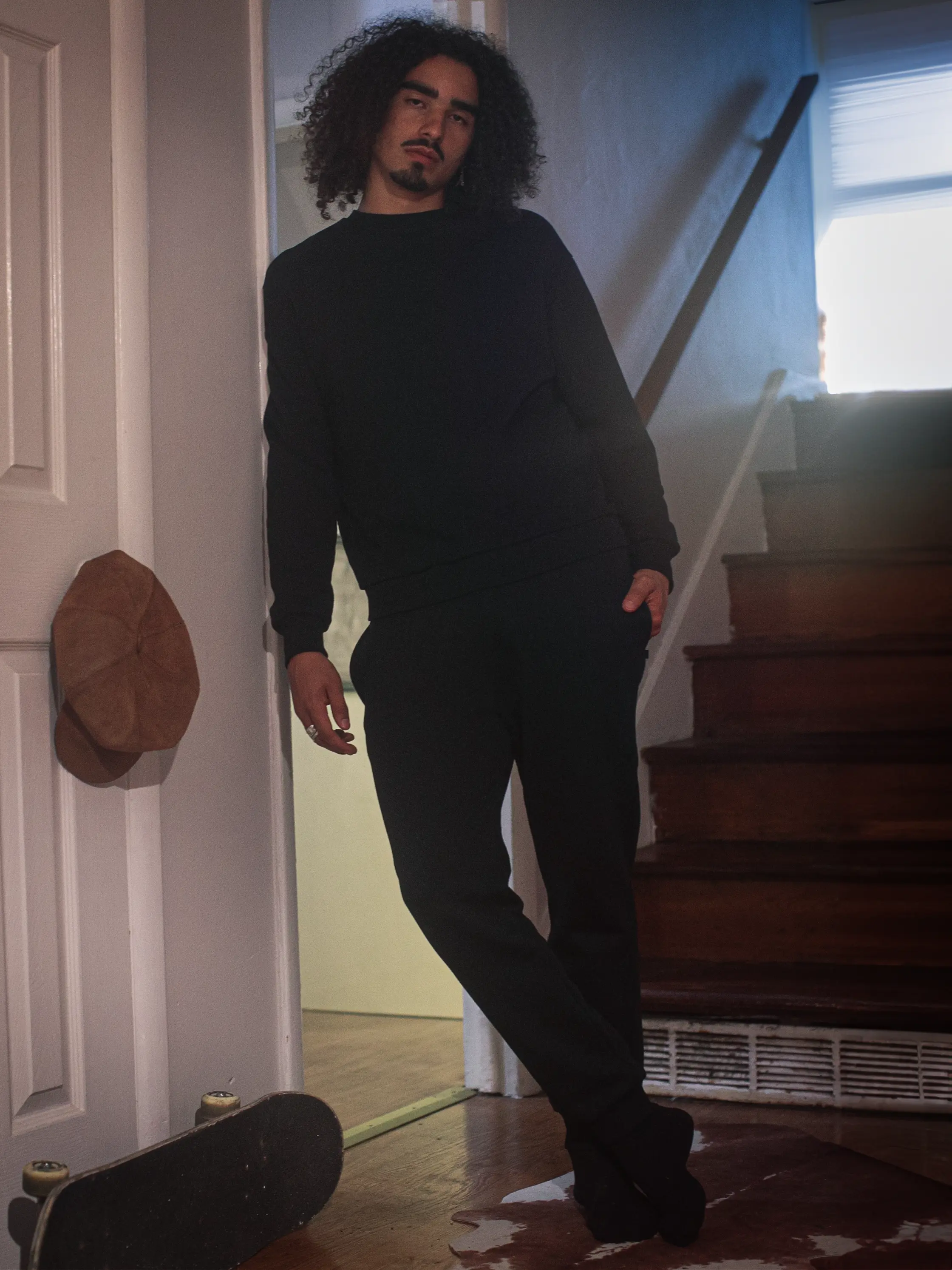 Close-up of a single green leaf against a white background.