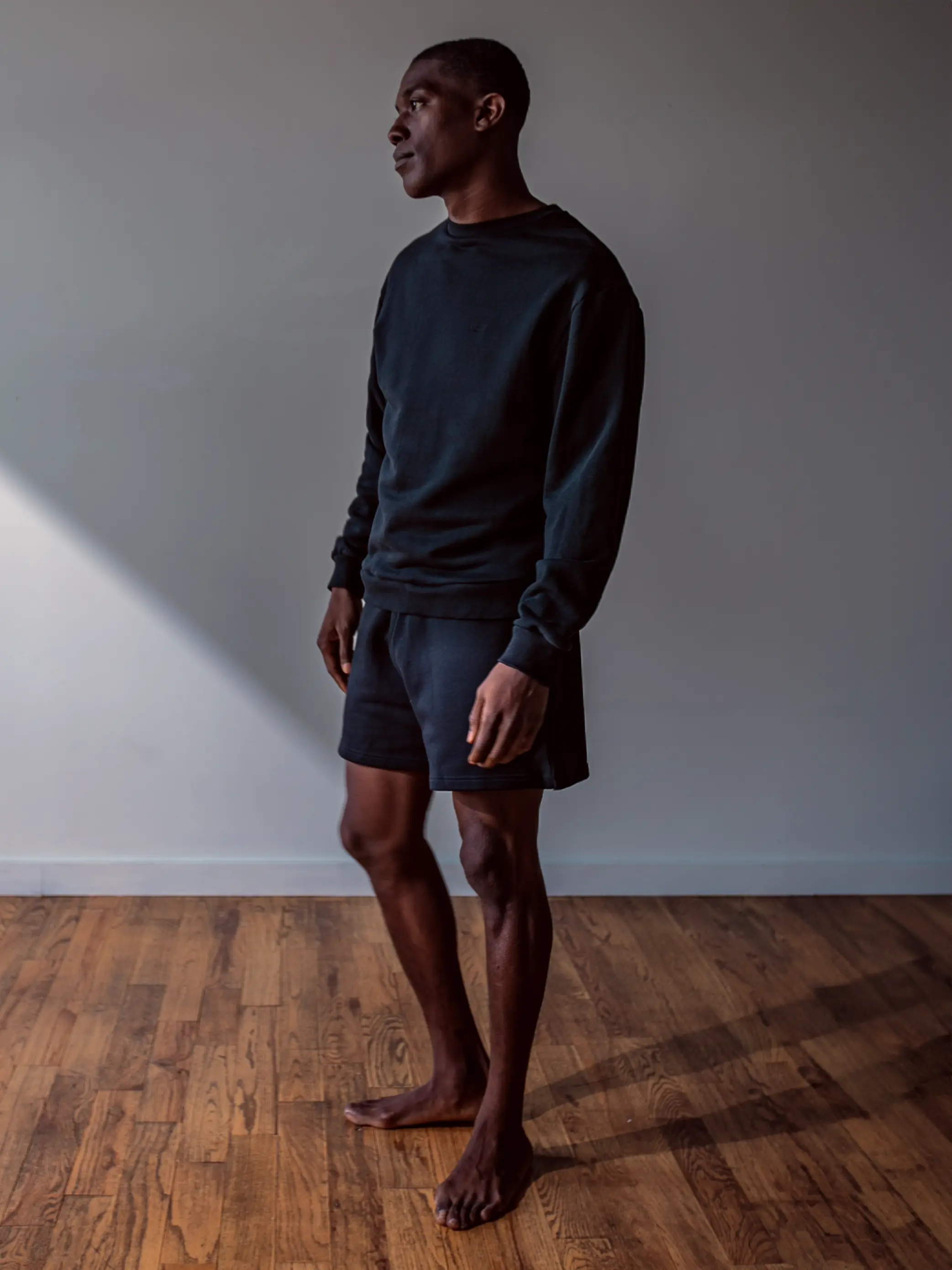 Close-up of a single green leaf against a white background.