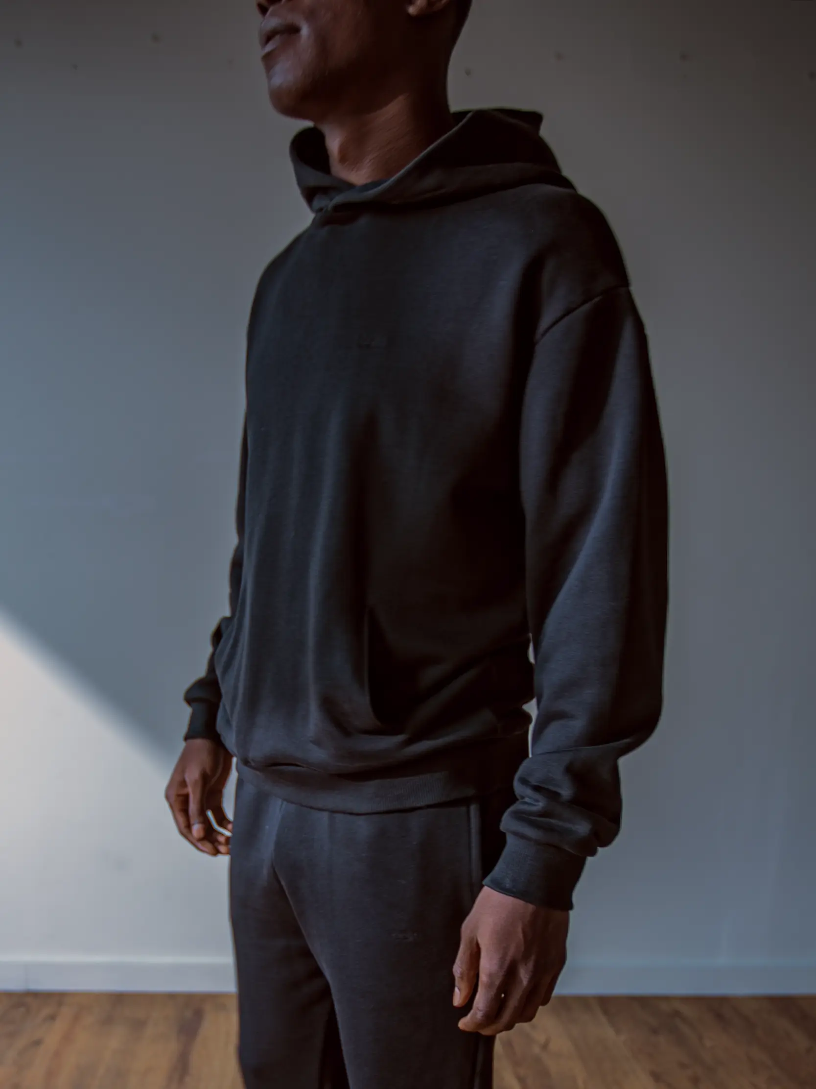 Close-up of a single green leaf against a white background.