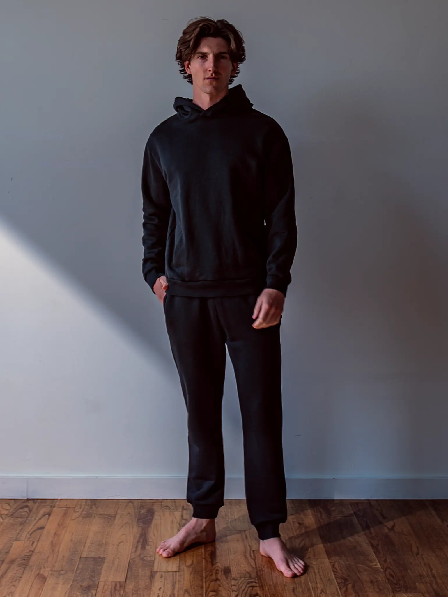 Close-up of a single green leaf against a white background.