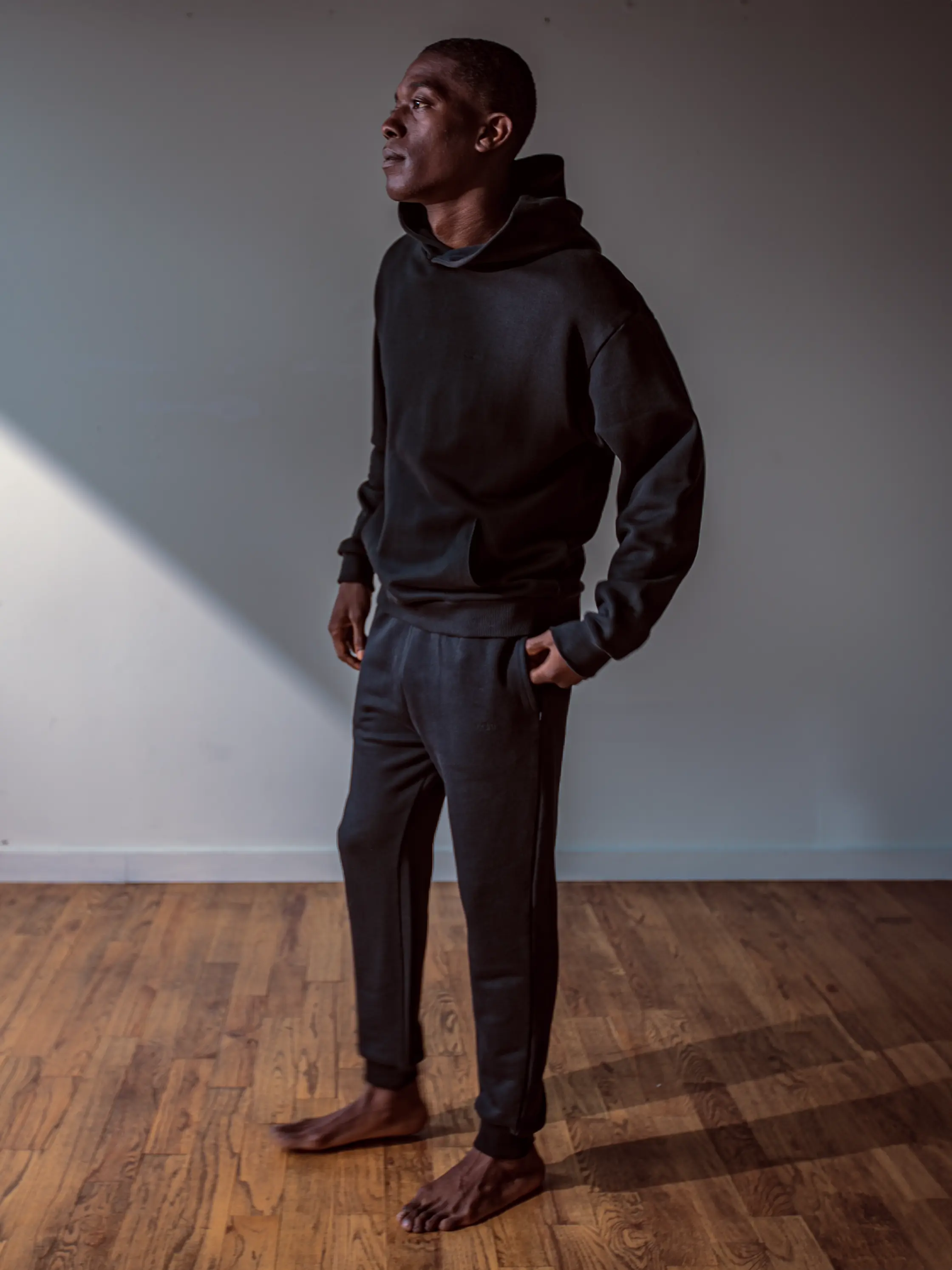 Close-up of a single green leaf against a white background.