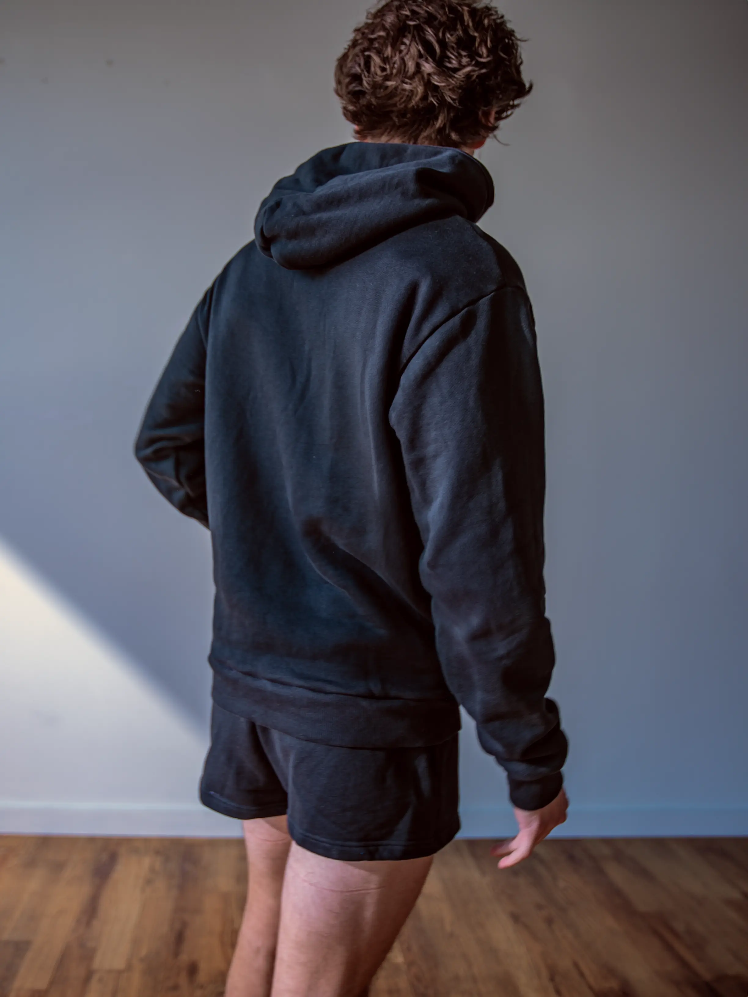 Close-up of a single green leaf against a white background.