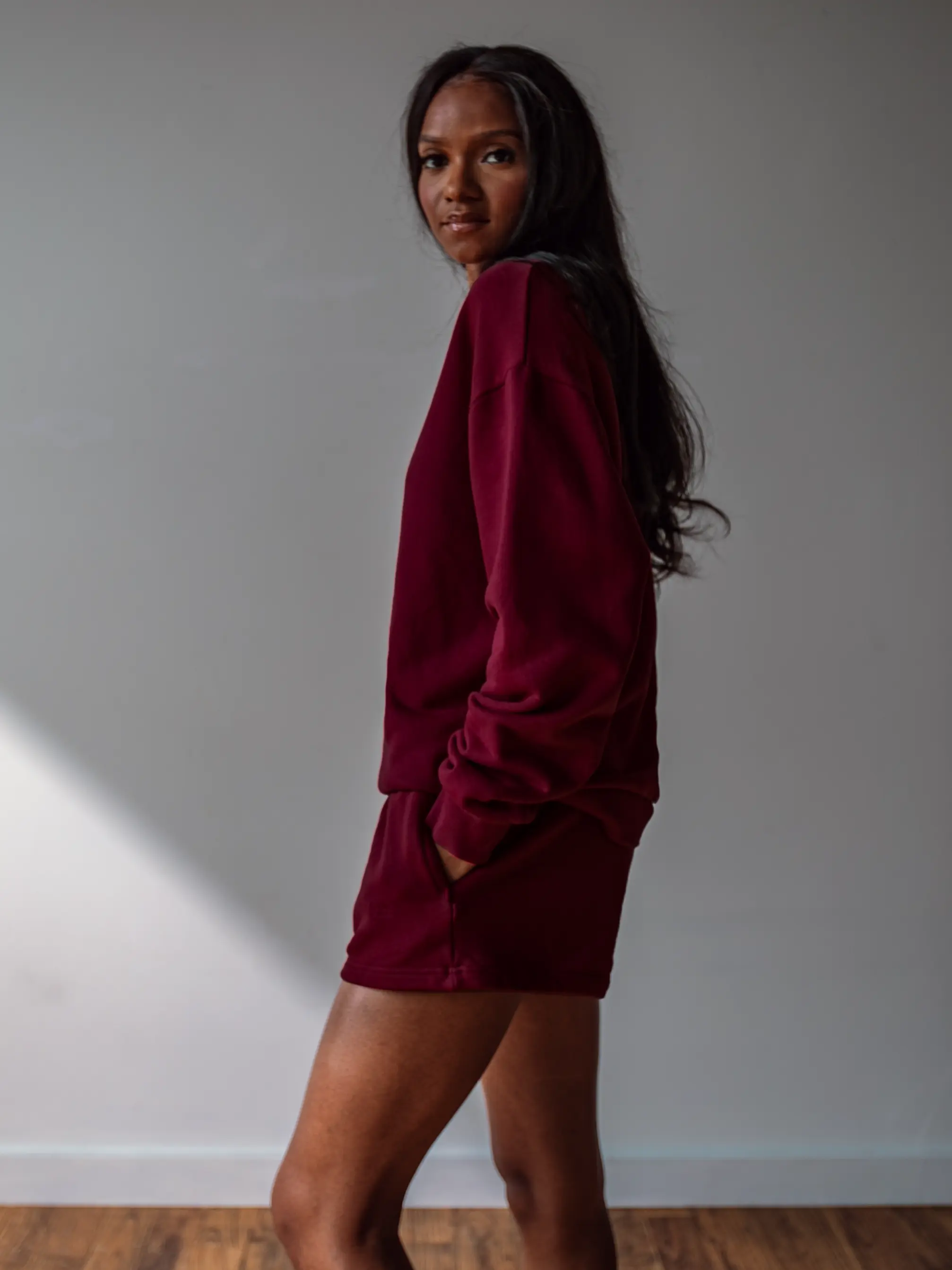 Close-up of a single green leaf against a white background.
