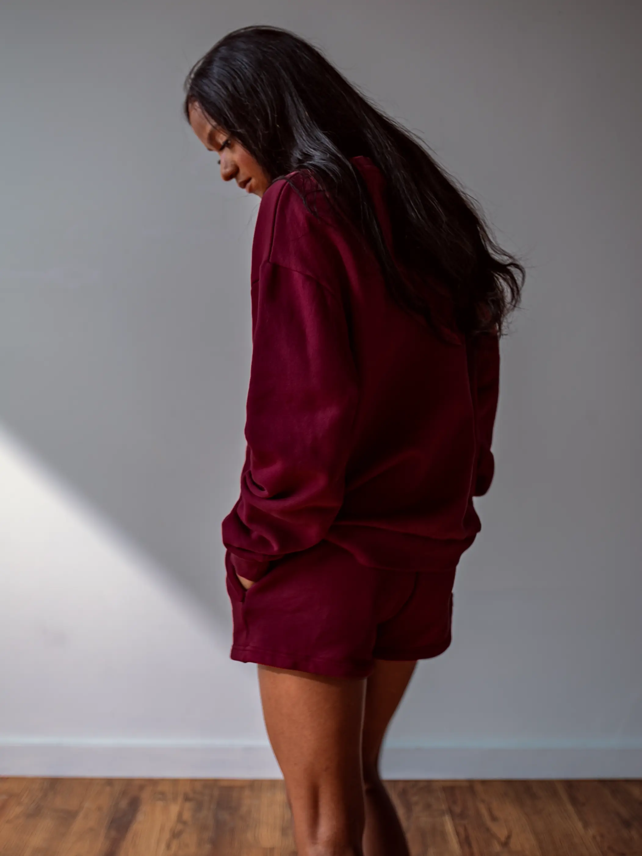 Close-up of a single green leaf against a white background.