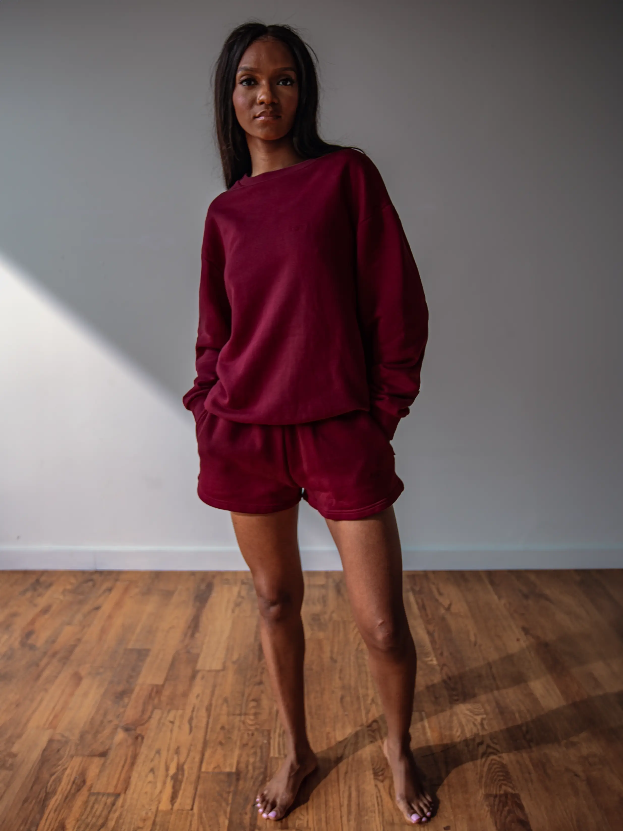 Close-up of a single green leaf against a white background.