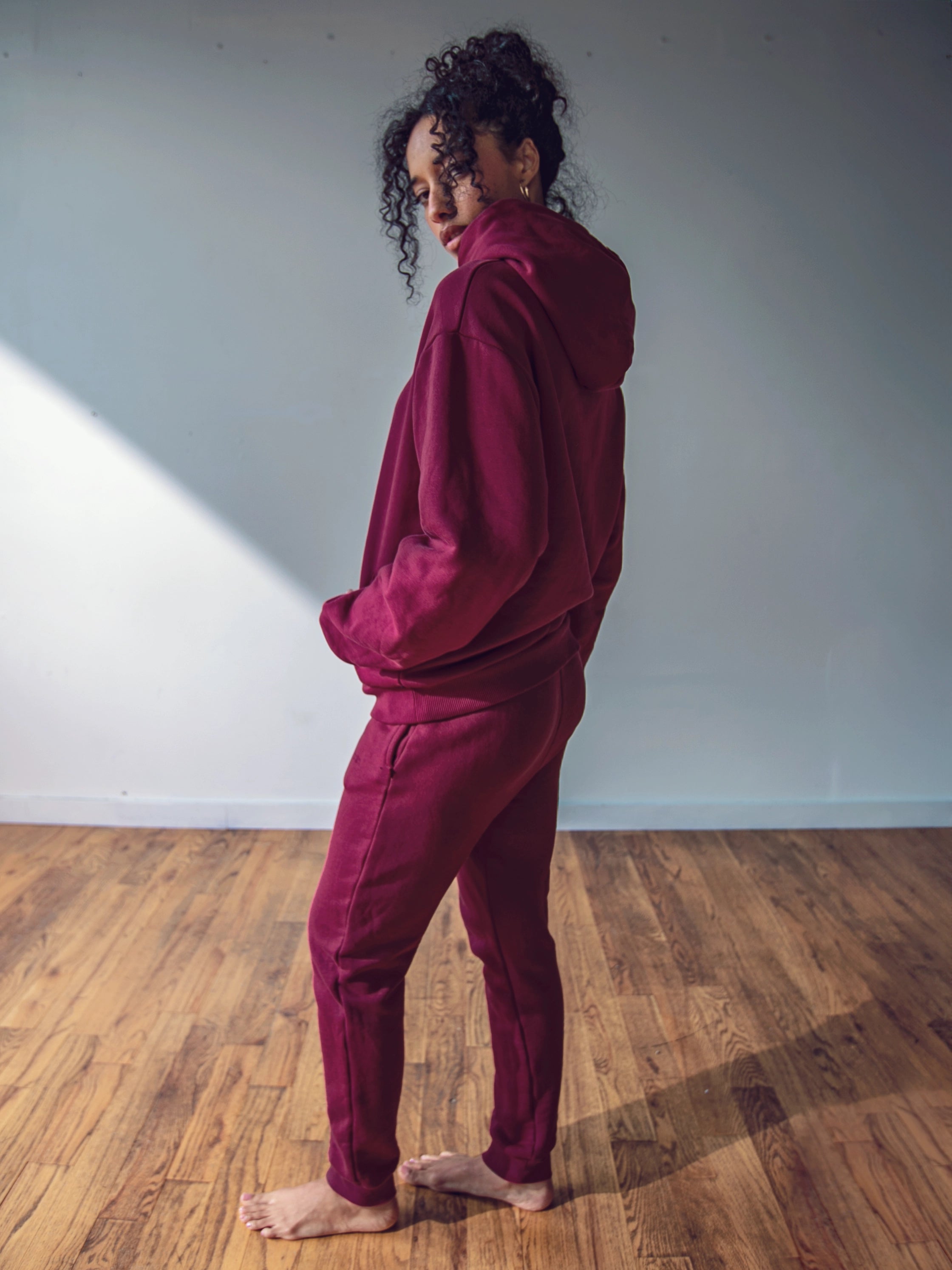 Close-up of a single green leaf against a white background.