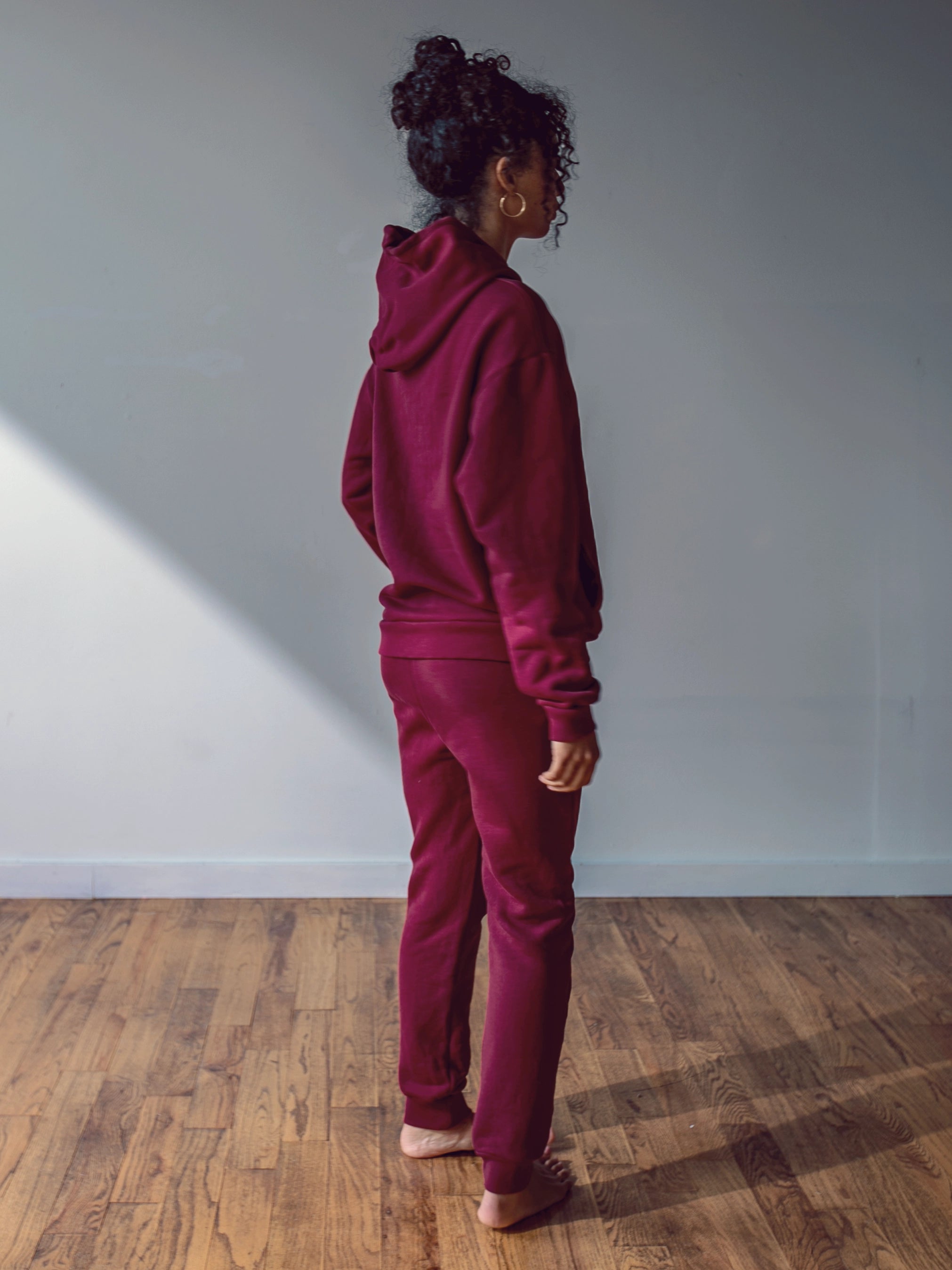 Close-up of a single green leaf against a white background.