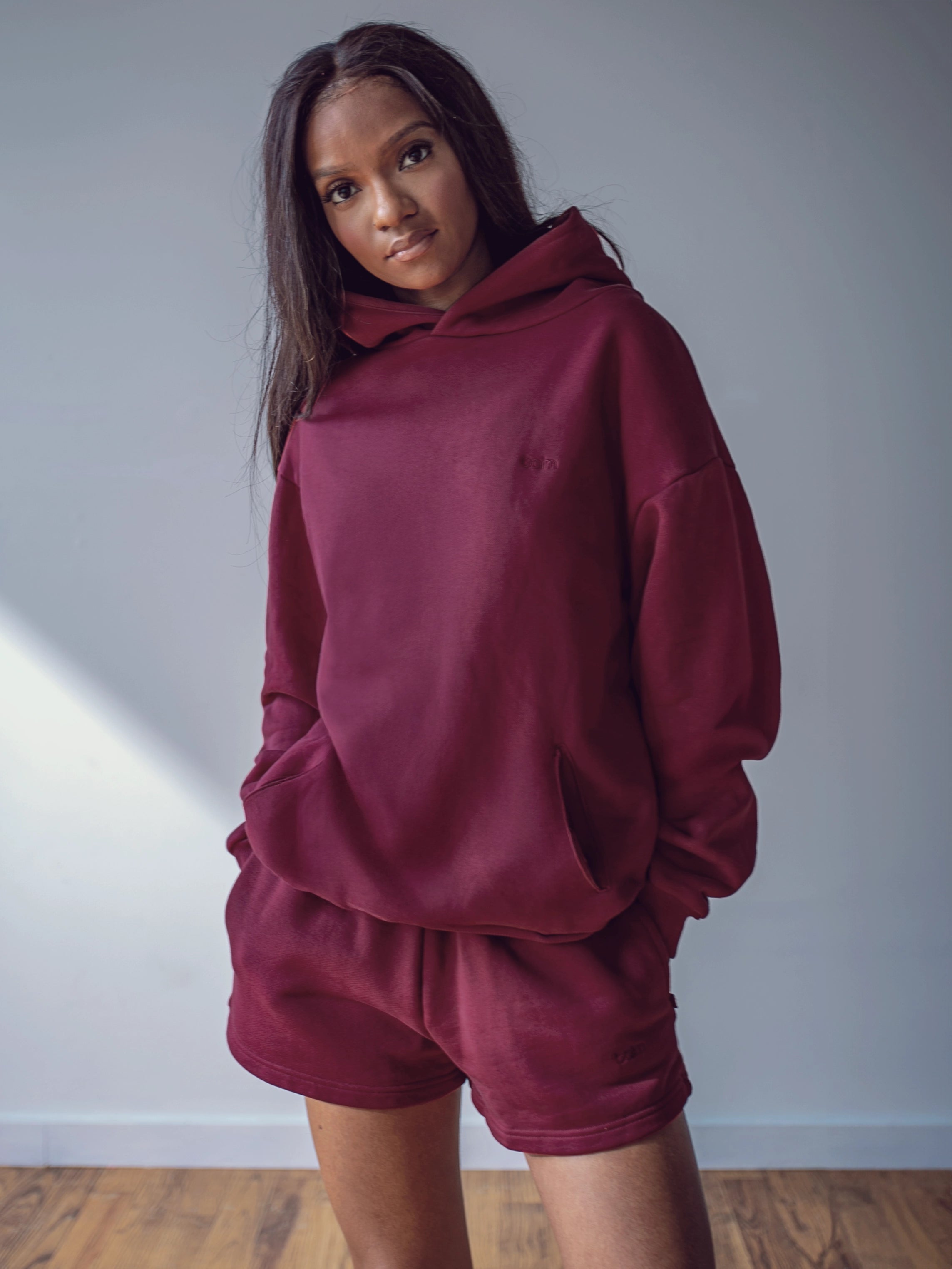 Close-up of a single green leaf against a white background.
