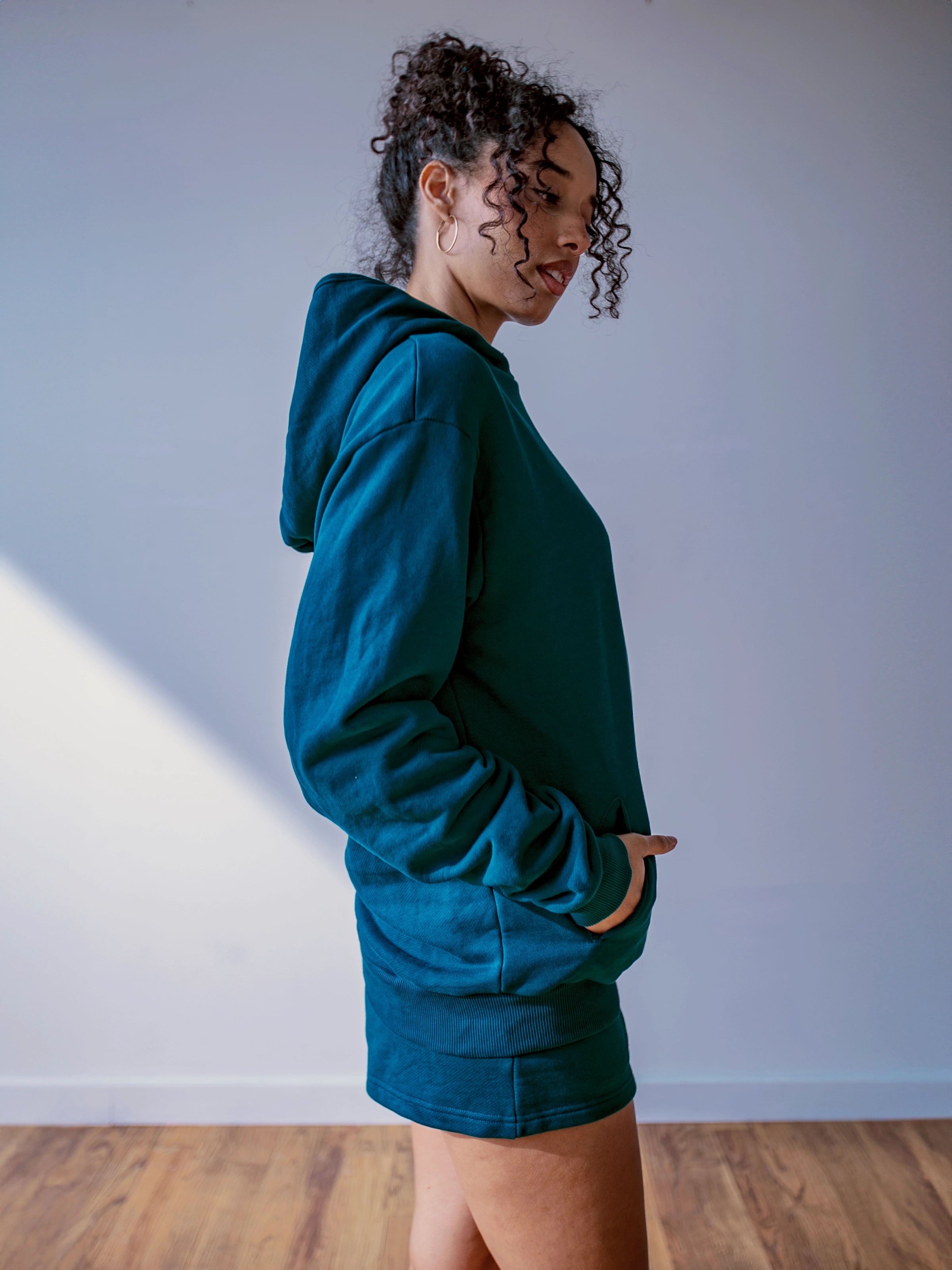 Close-up of a single green leaf against a white background.
