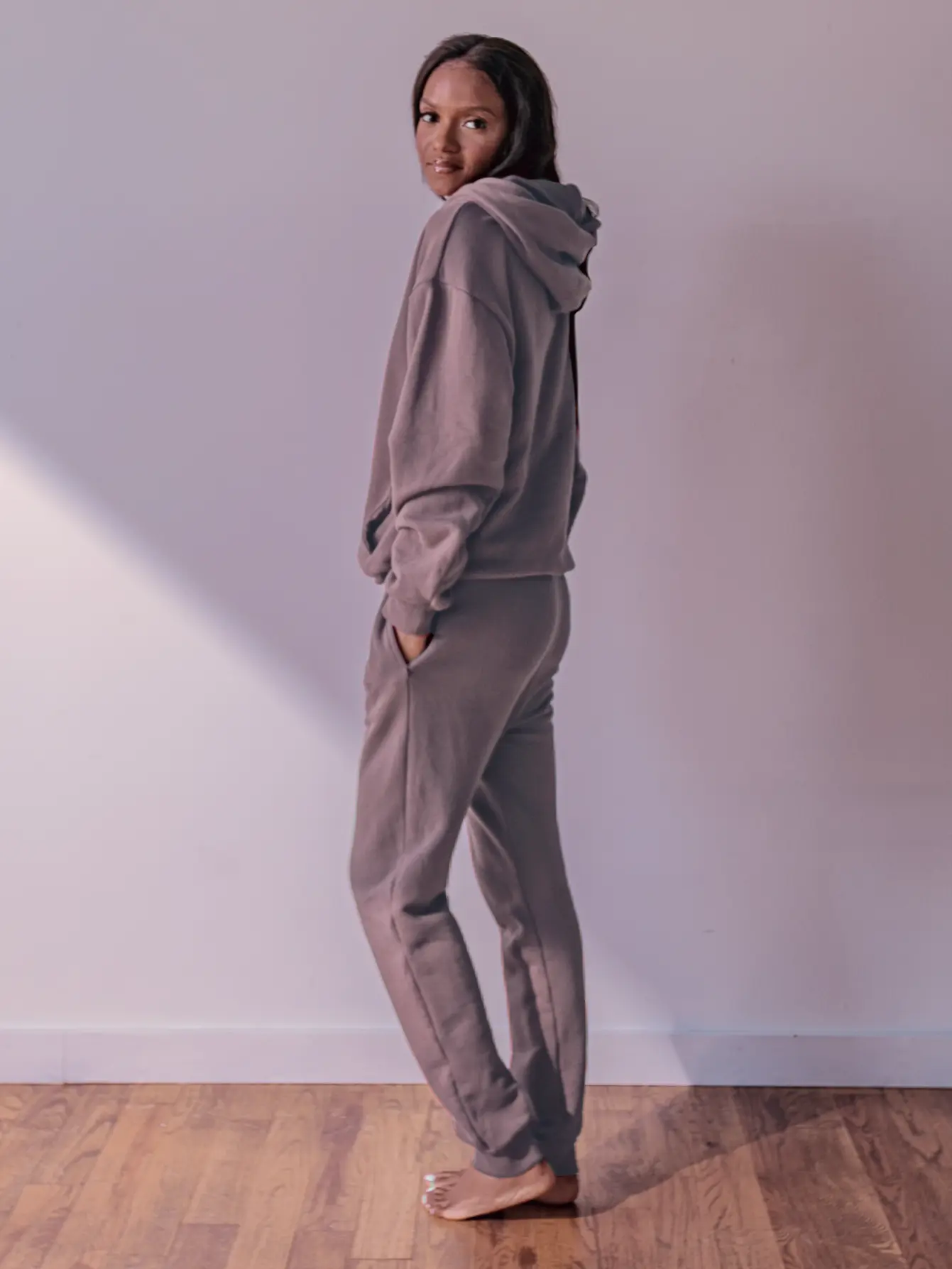 Close-up of a single green leaf against a white background.