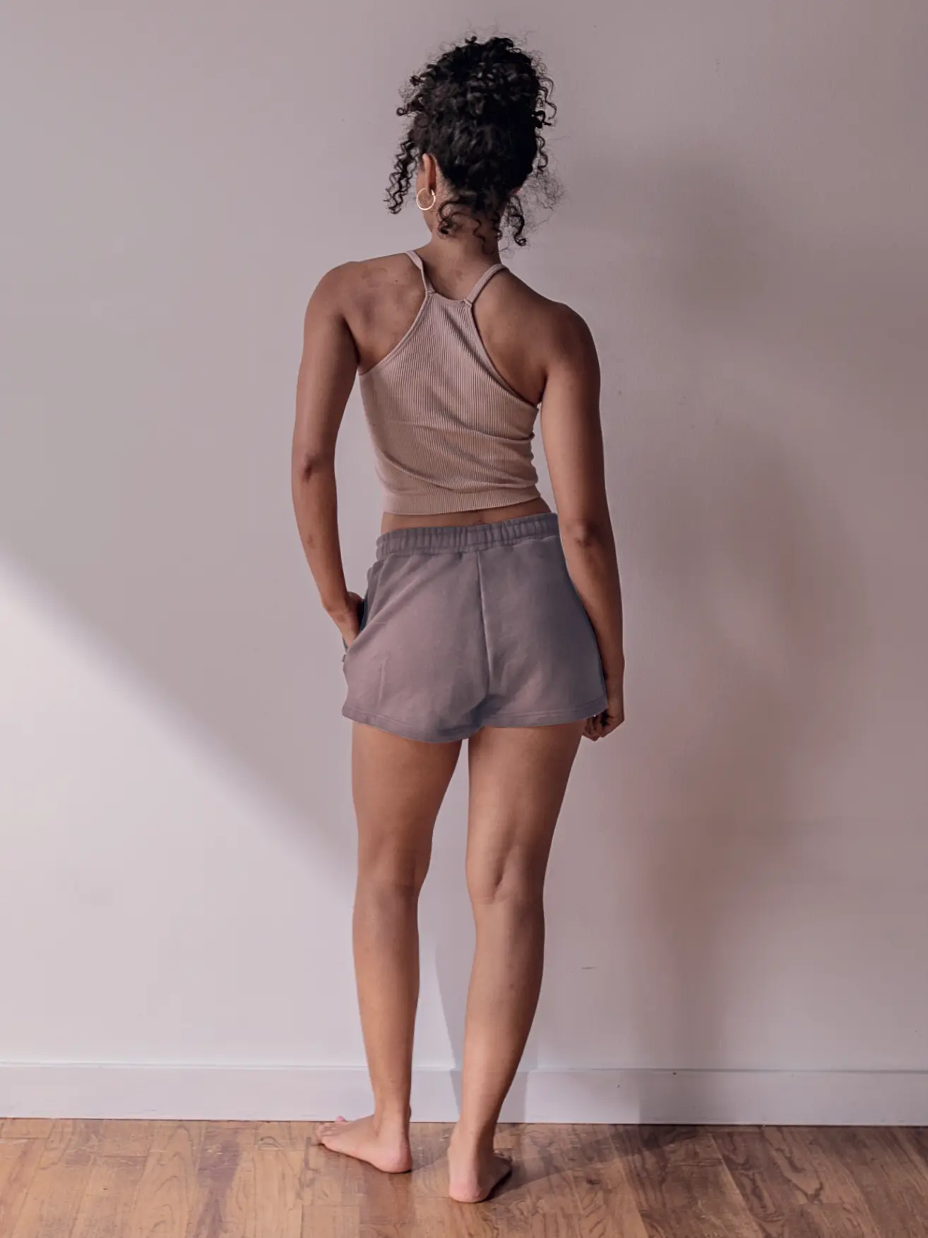 Close-up of a single green leaf against a white background.