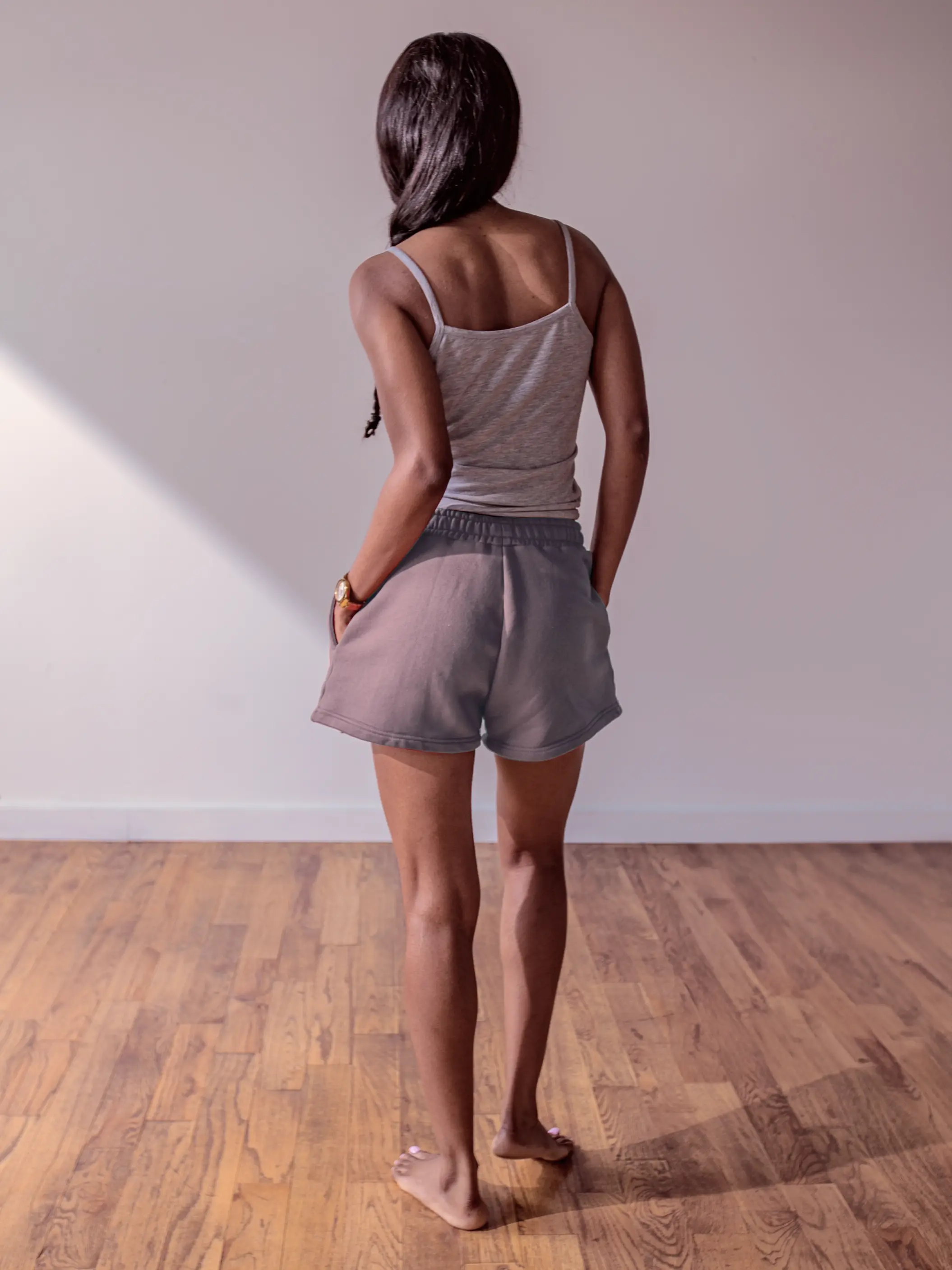 Close-up of a single green leaf against a white background.