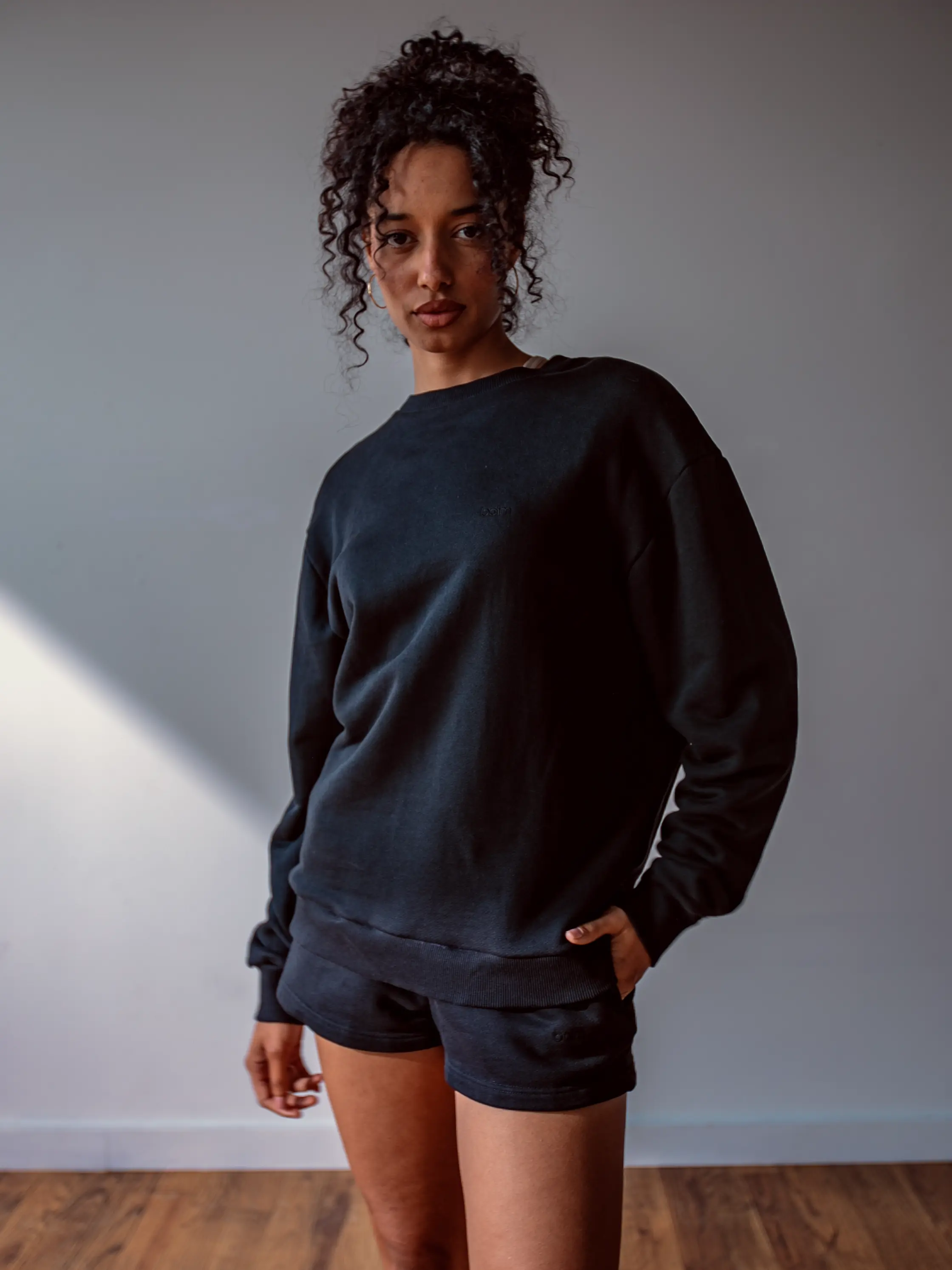 Close-up of a single green leaf against a white background.