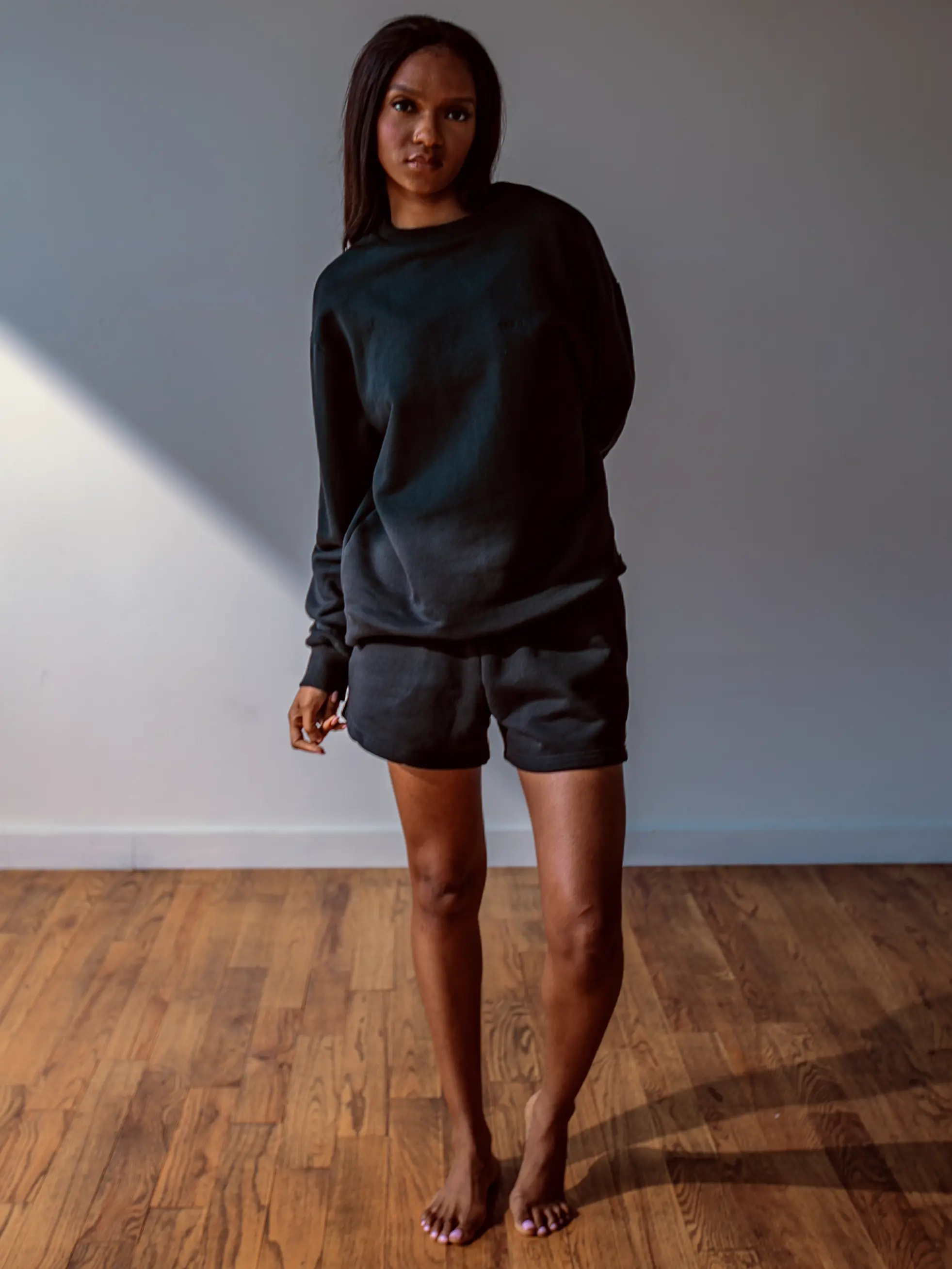 Close-up of a single green leaf against a white background.