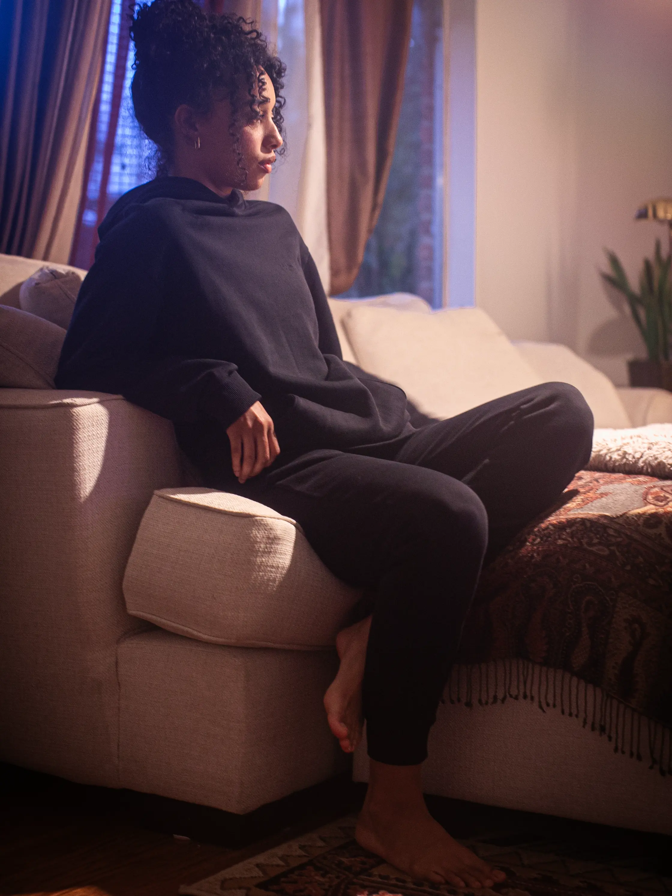 Close-up of a single green leaf against a white background.