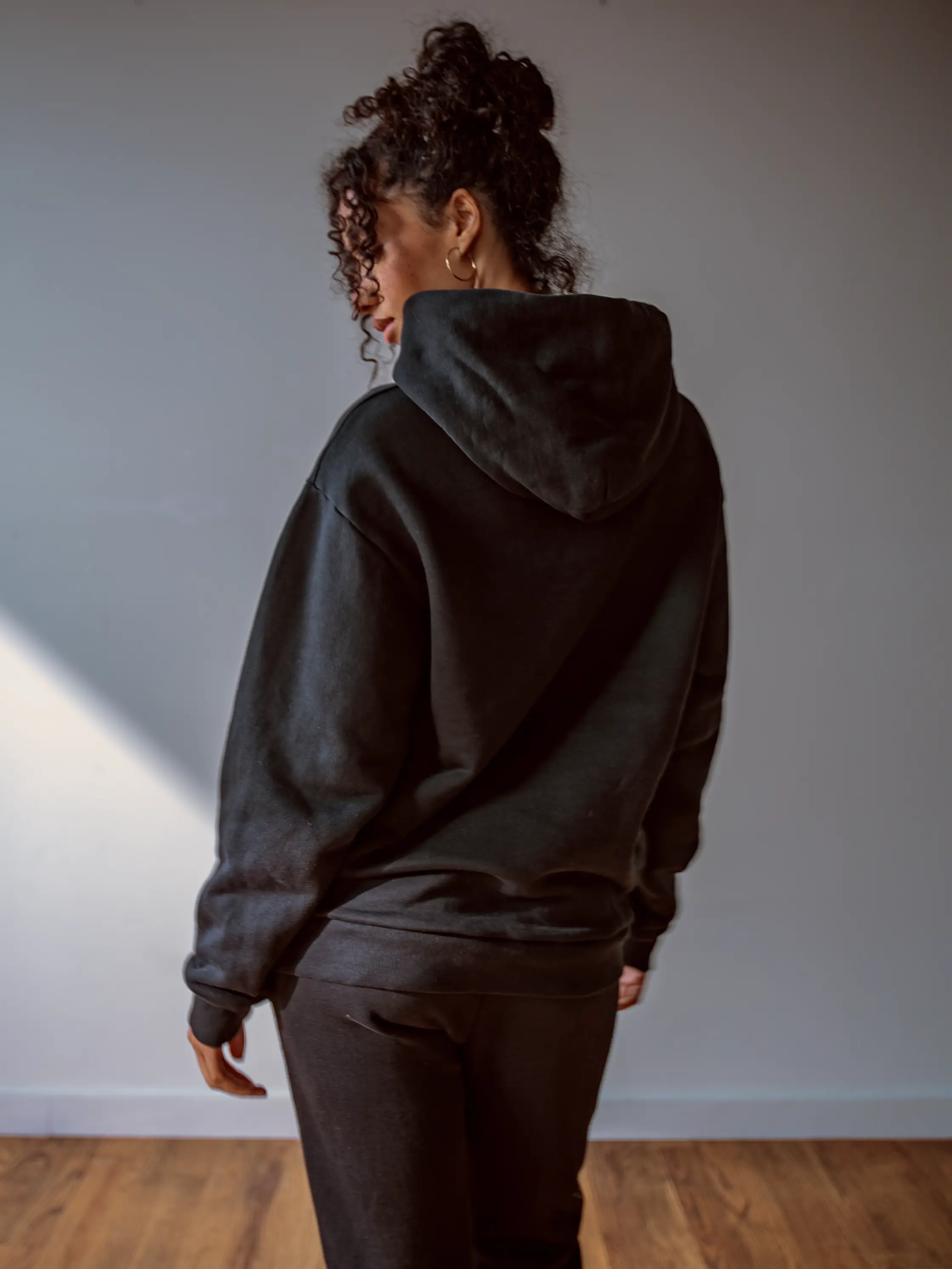 Close-up of a single green leaf against a white background.