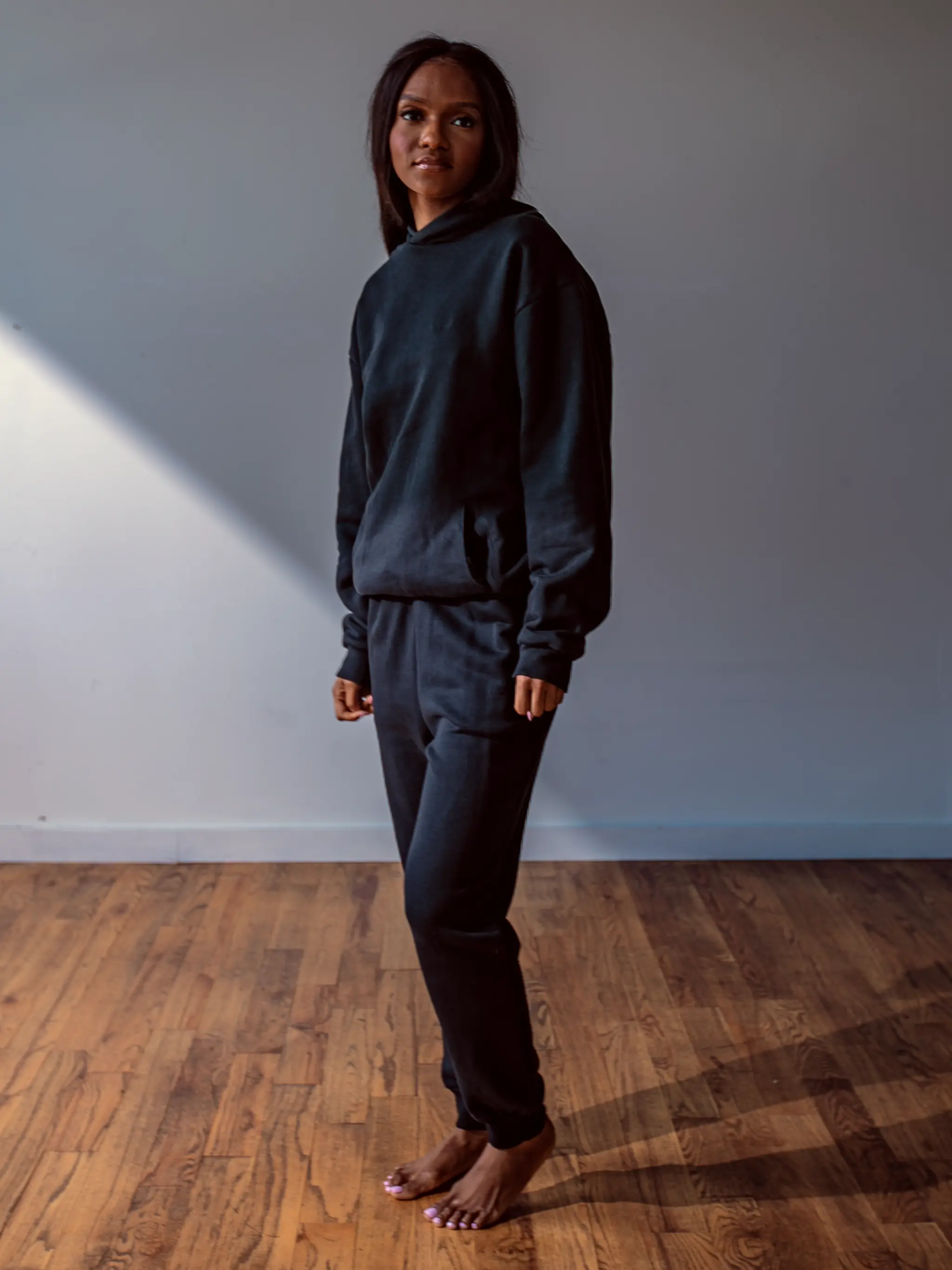 Close-up of a single green leaf against a white background.