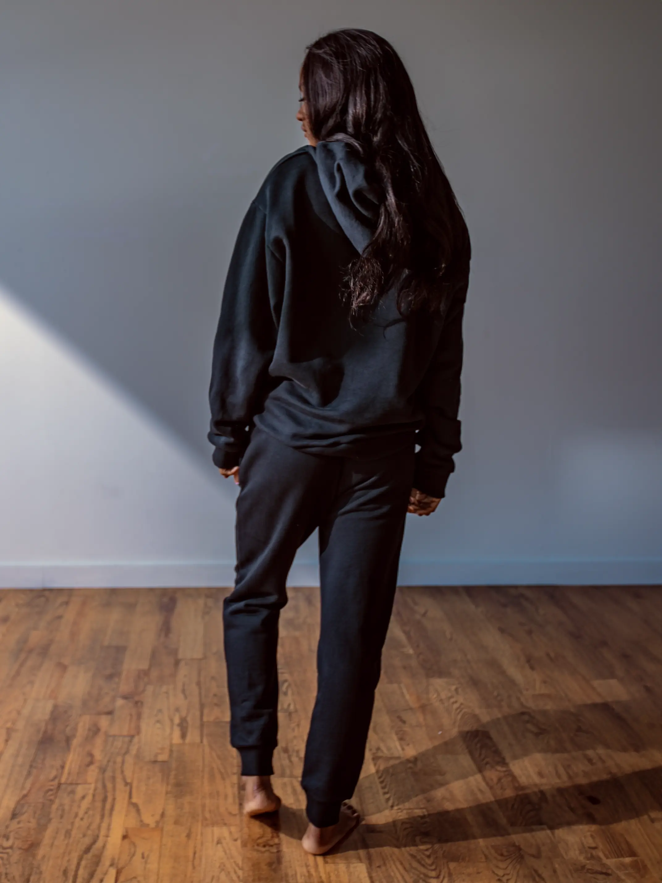 Close-up of a single green leaf against a white background.
