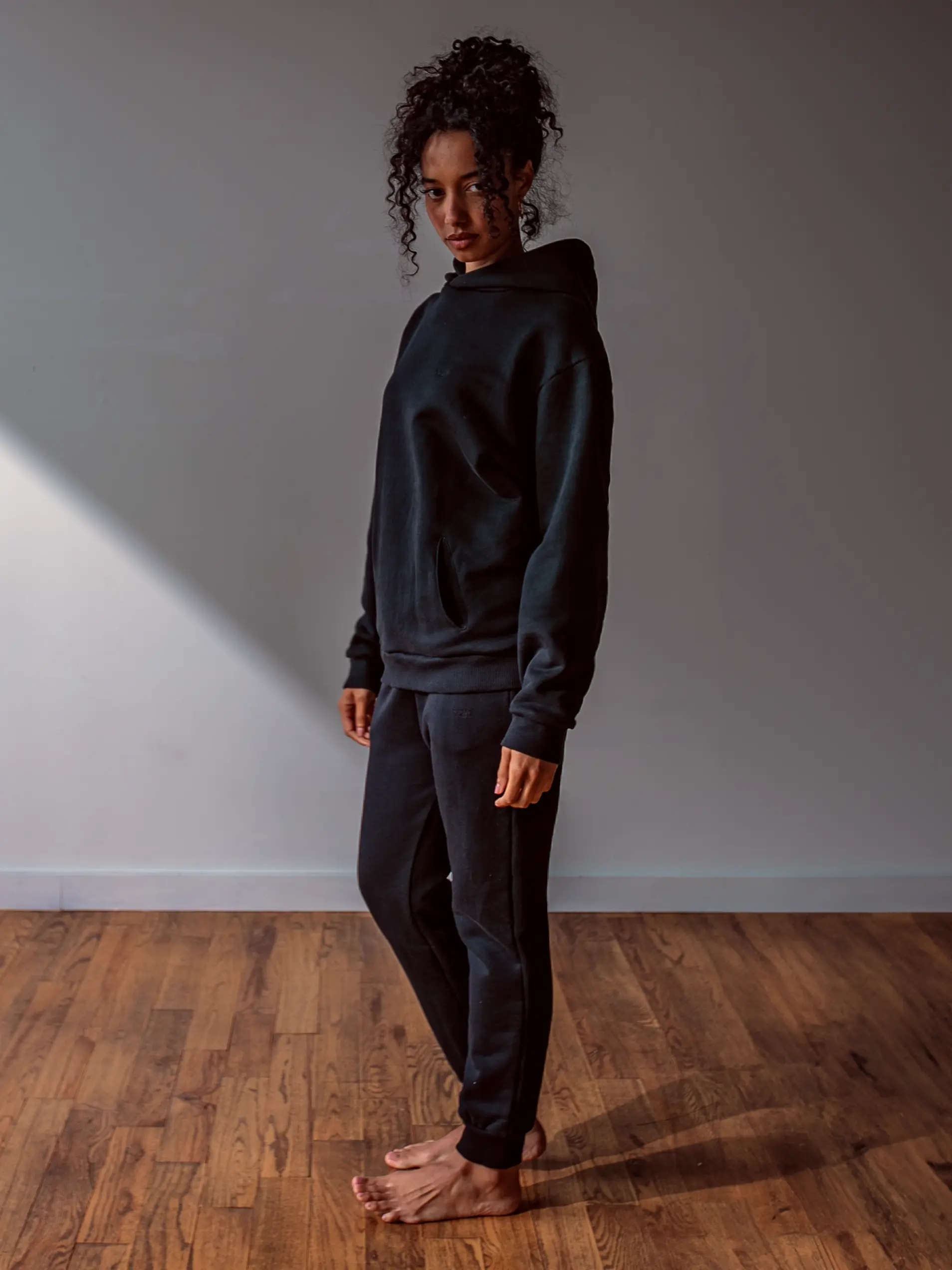 Close-up of a single green leaf against a white background.