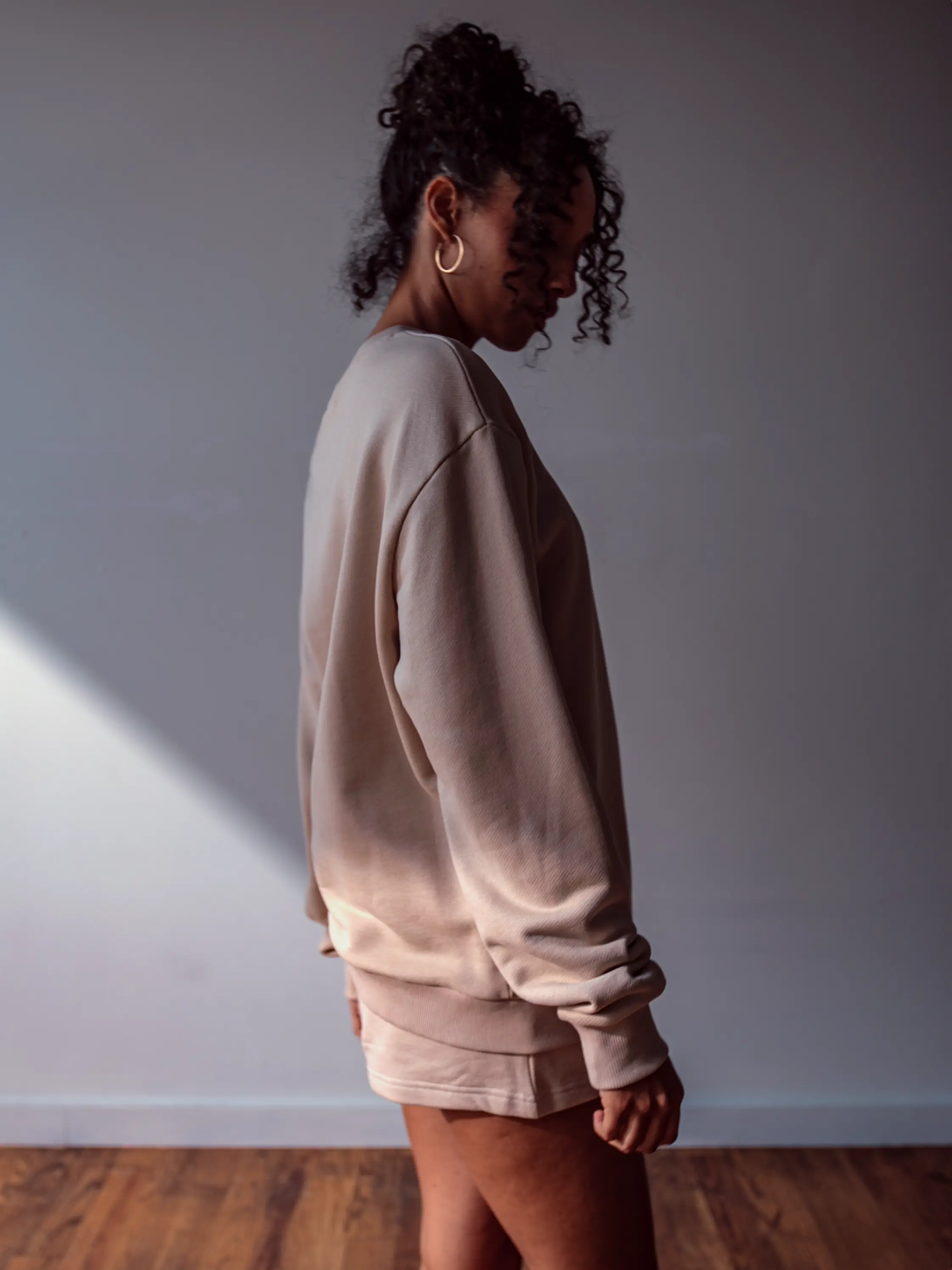Close-up of a single green leaf against a white background.