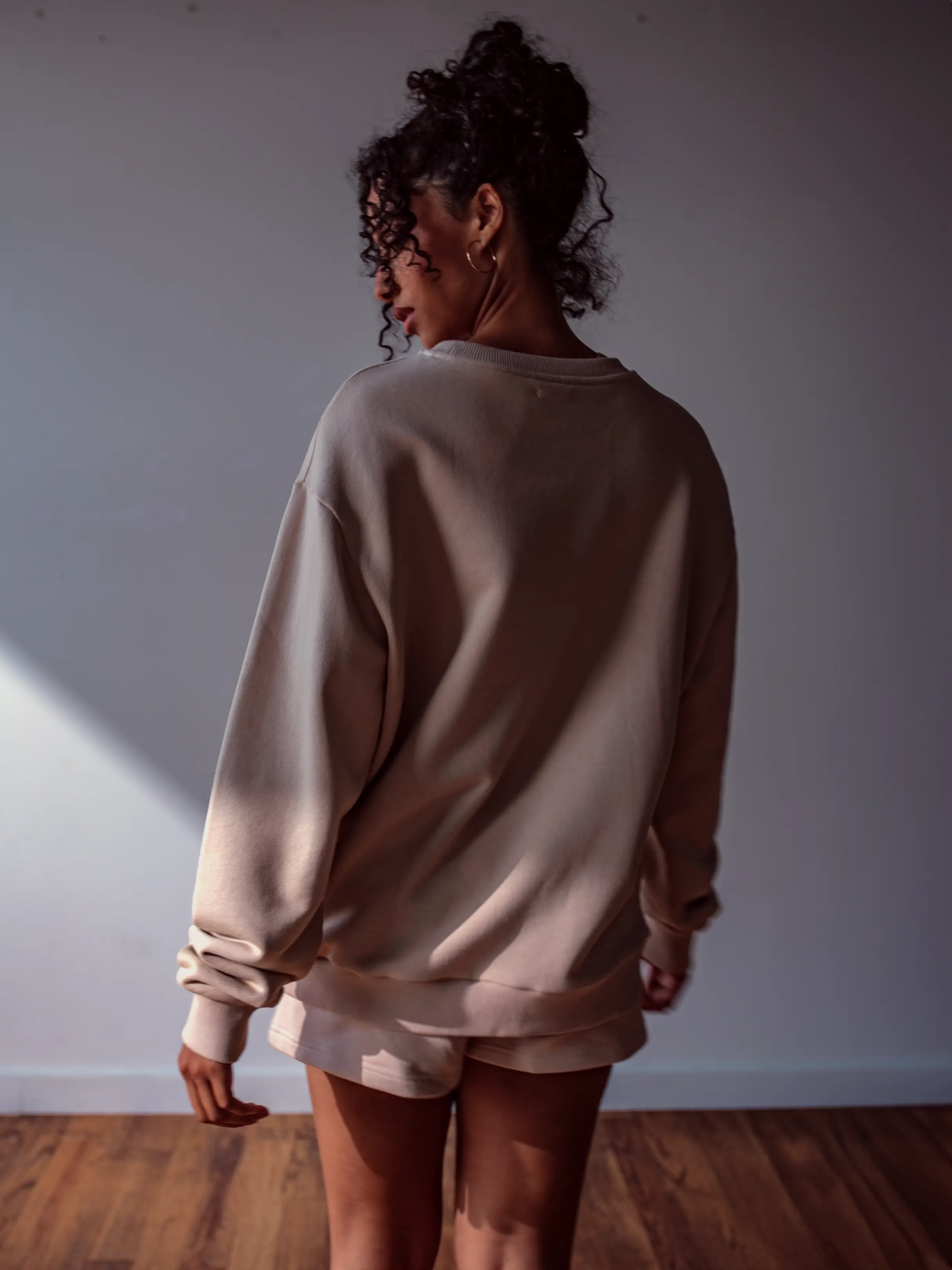 Close-up of a single green leaf against a white background.