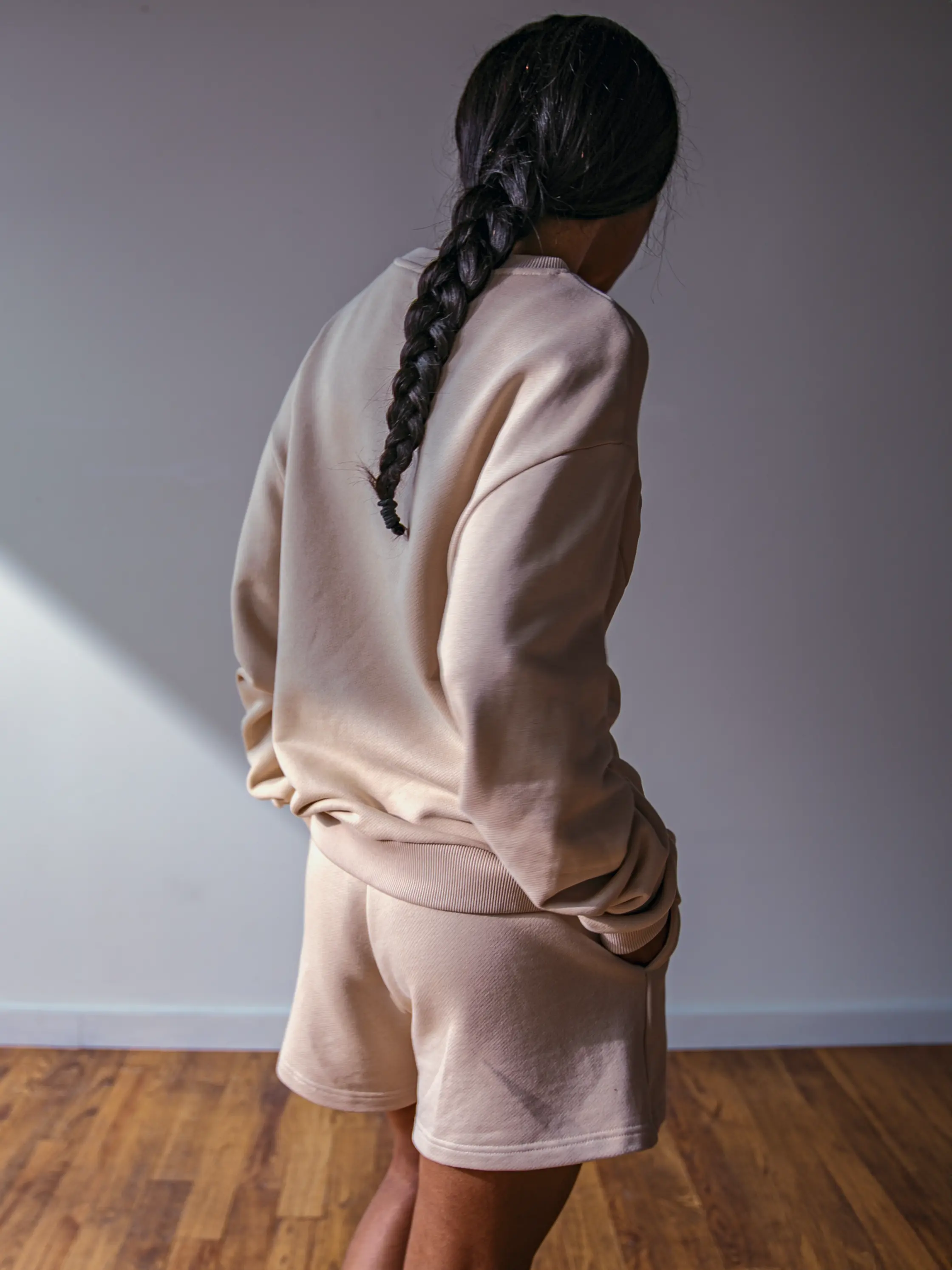 Close-up of a single green leaf against a white background.