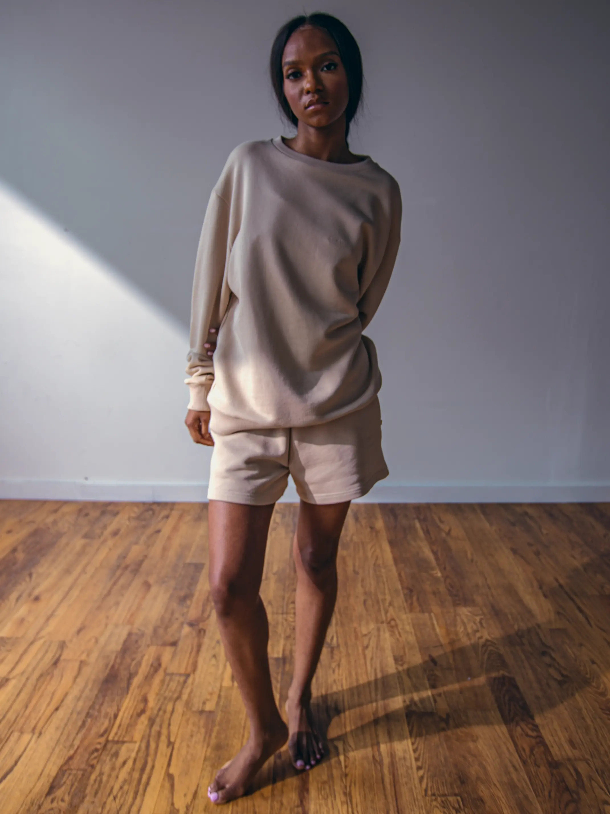 Close-up of a single green leaf against a white background.