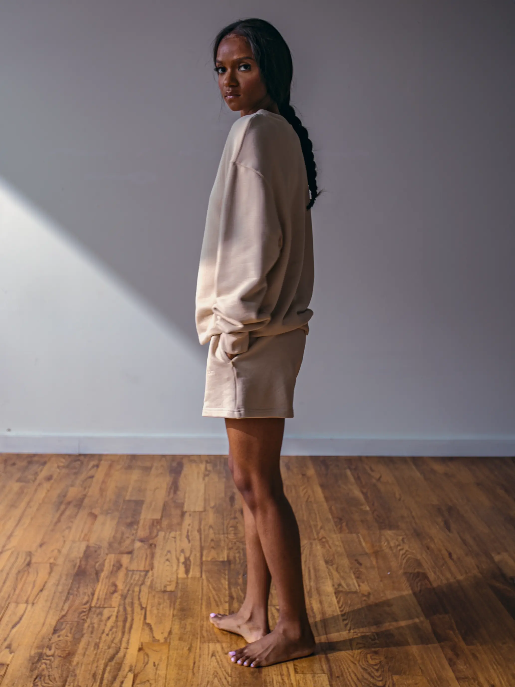 Close-up of a single green leaf against a white background.