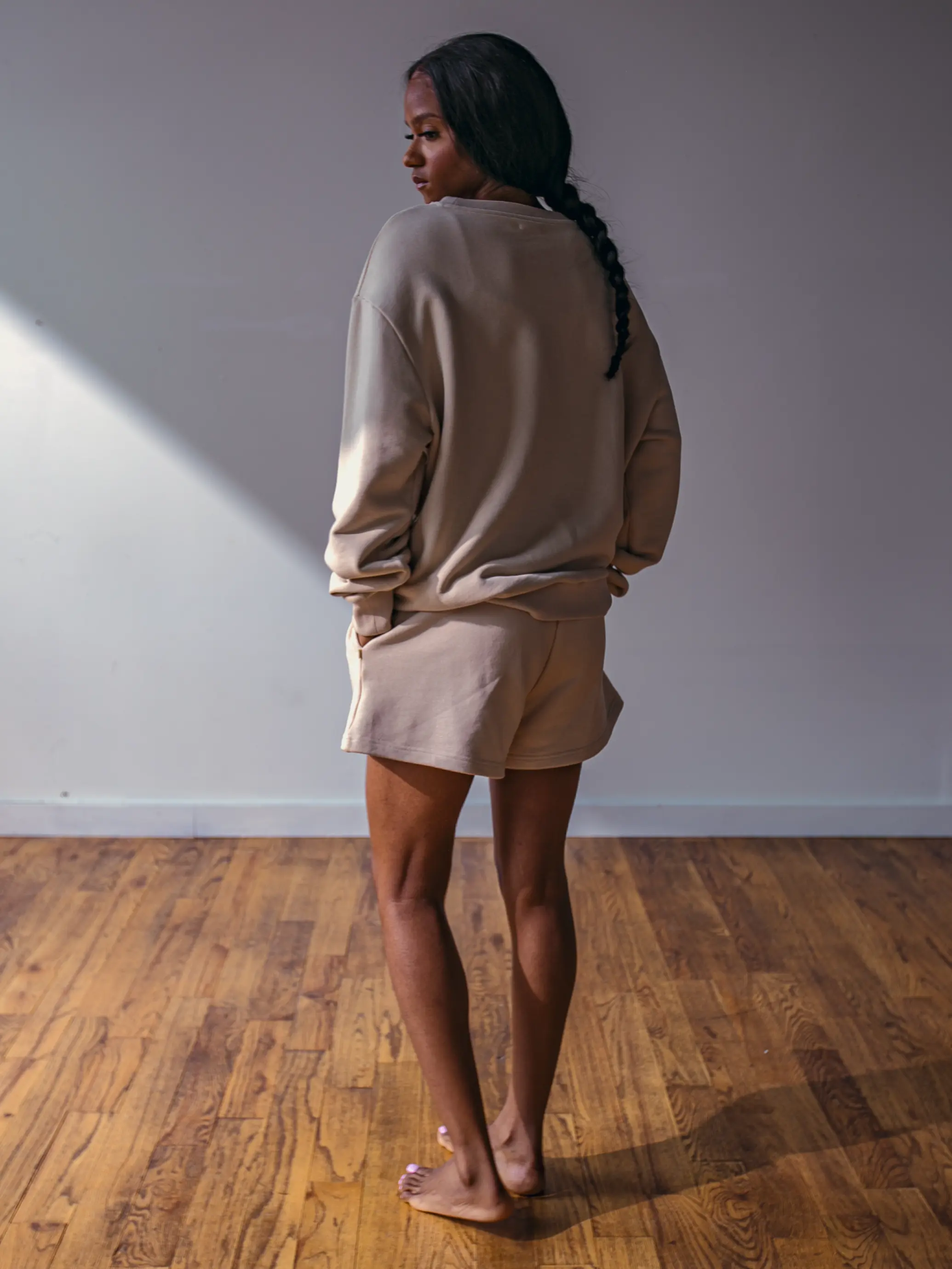 Close-up of a single green leaf against a white background.