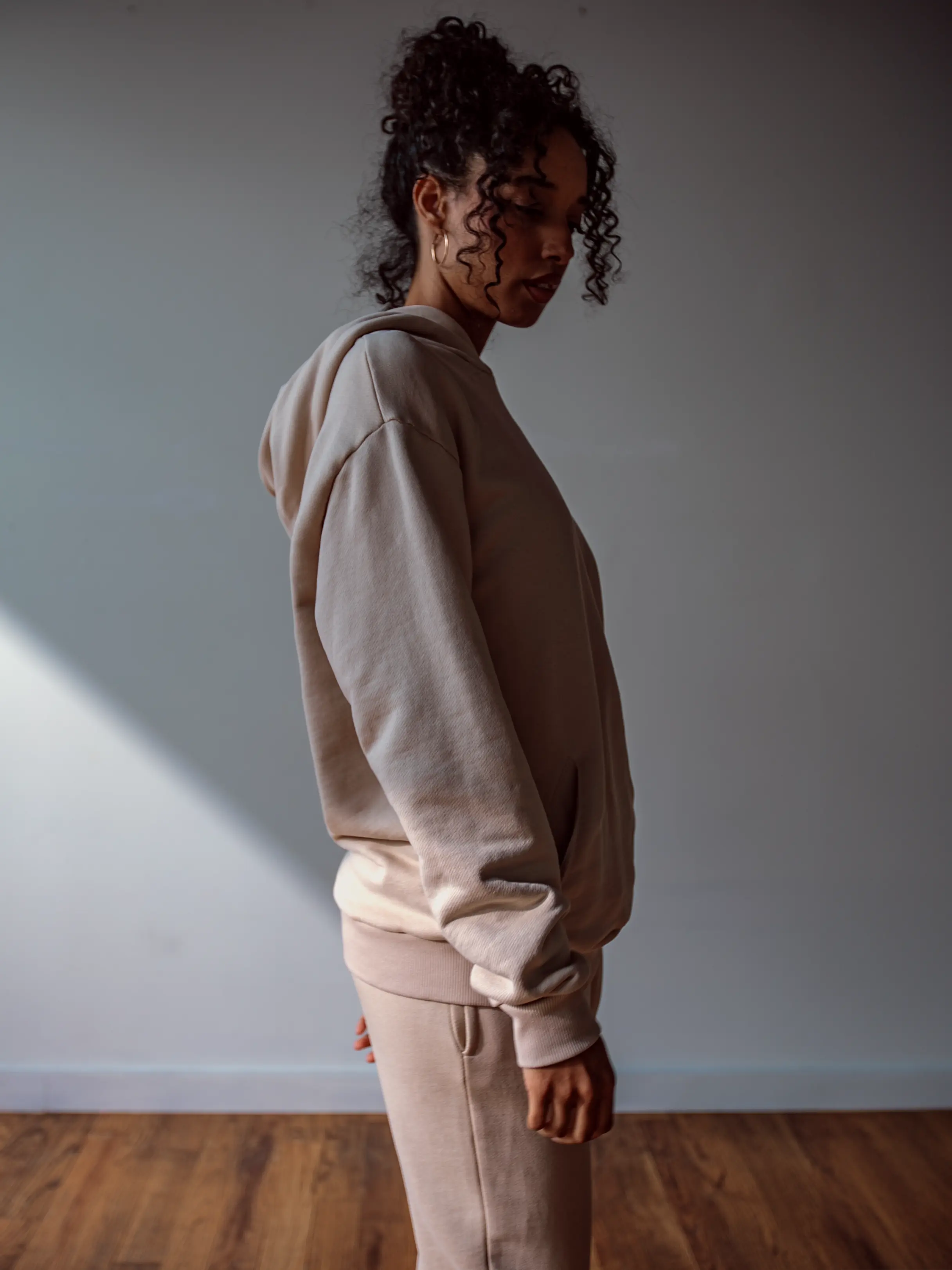 Close-up of a single green leaf against a white background.