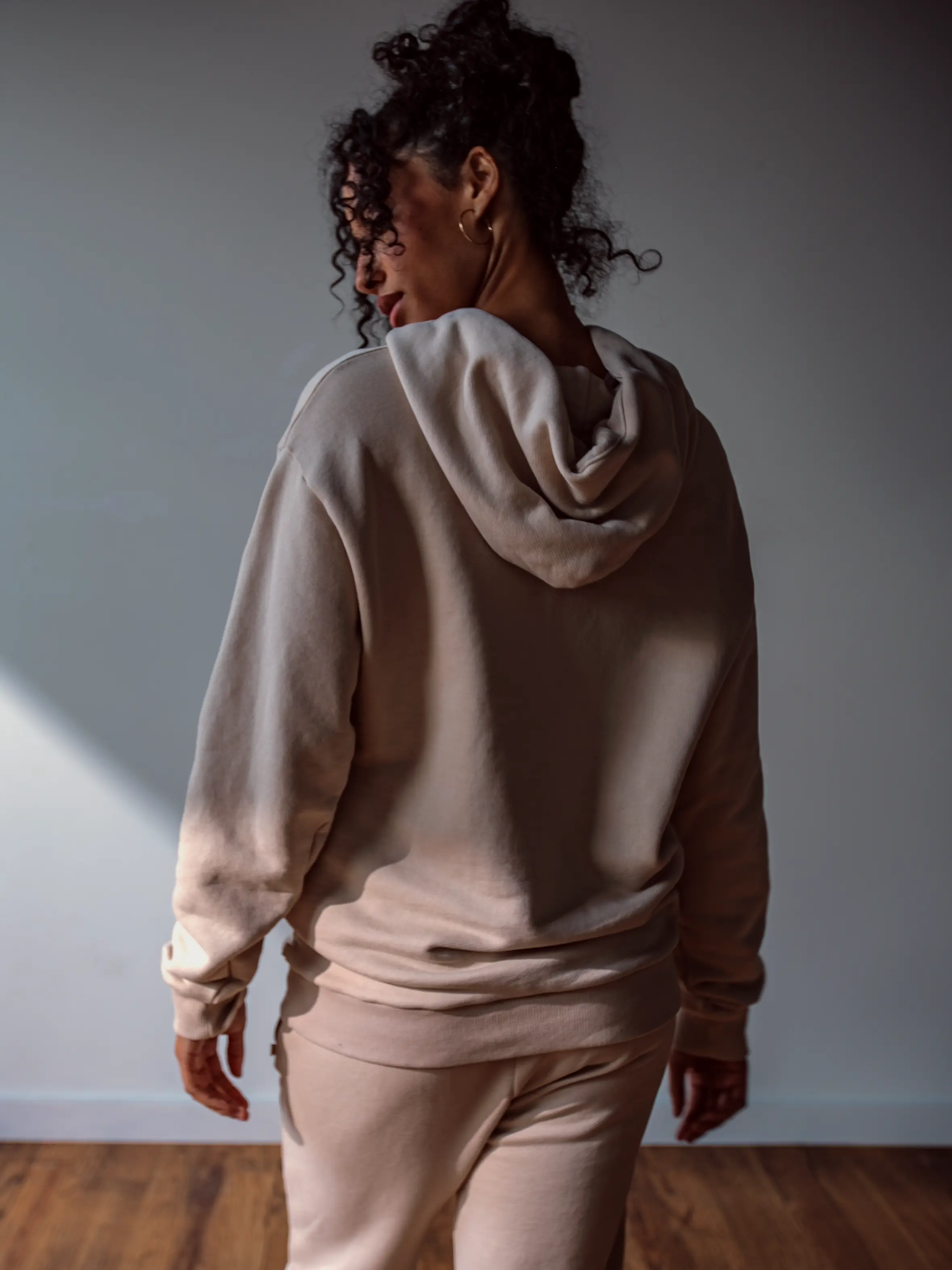 Close-up of a single green leaf against a white background.