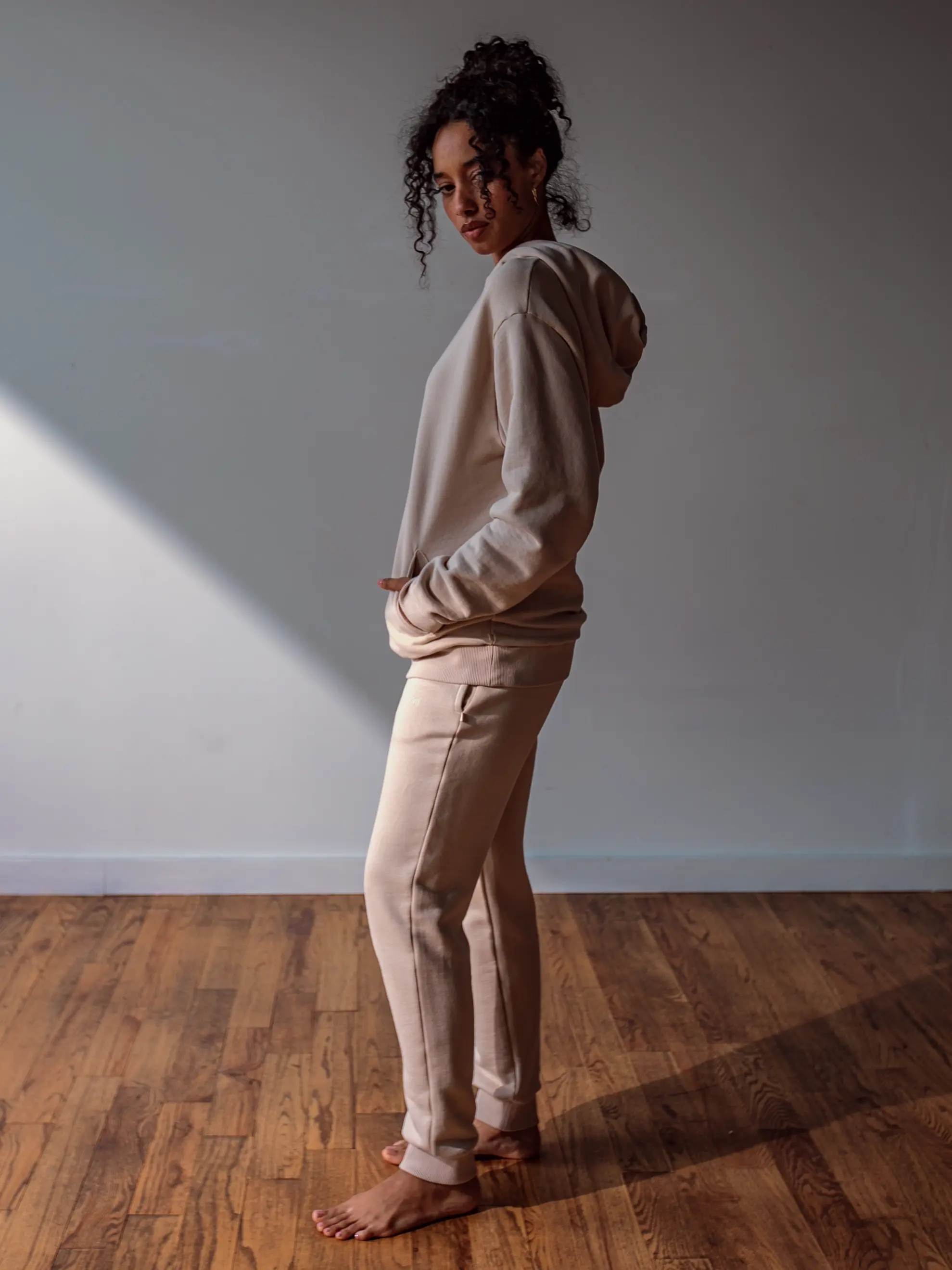 Close-up of a single green leaf against a white background.