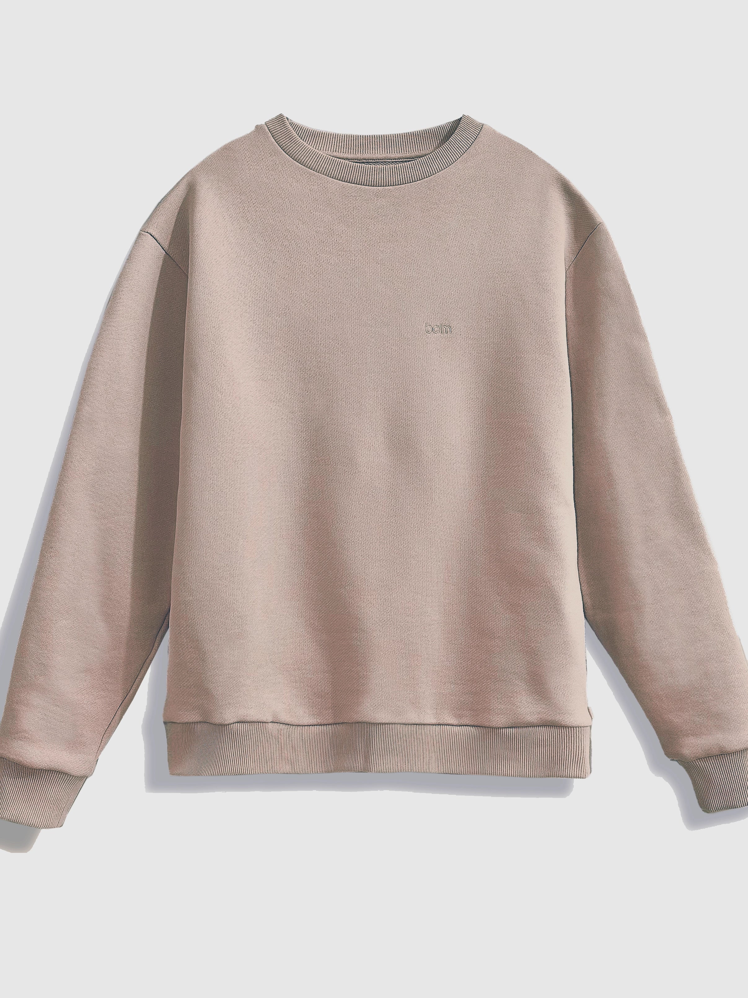 Close-up of a single green leaf against a white background.