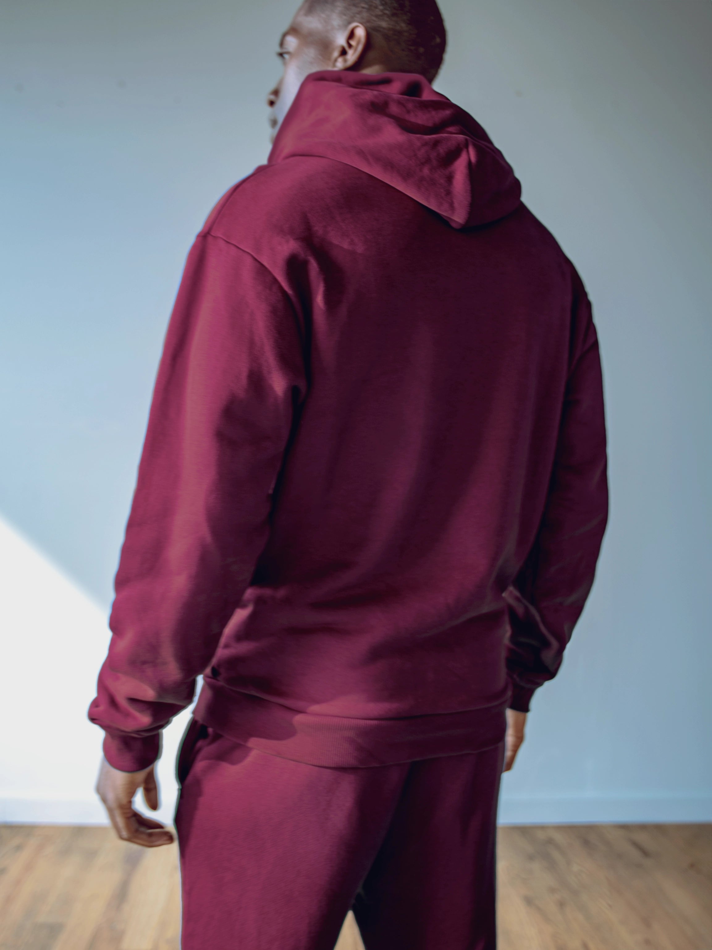 Close-up of a single green leaf against a white background.