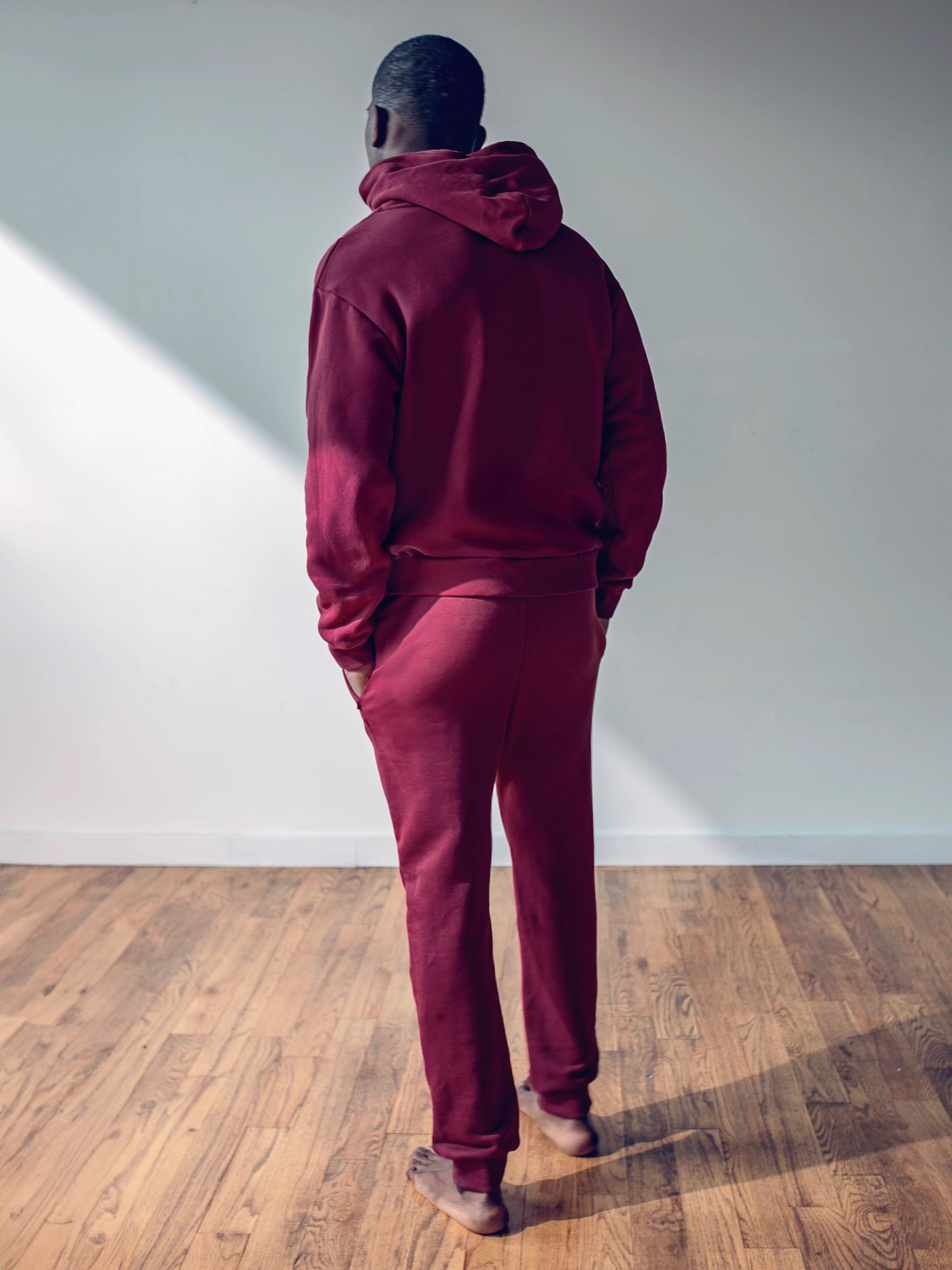Close-up of a single green leaf against a white background.