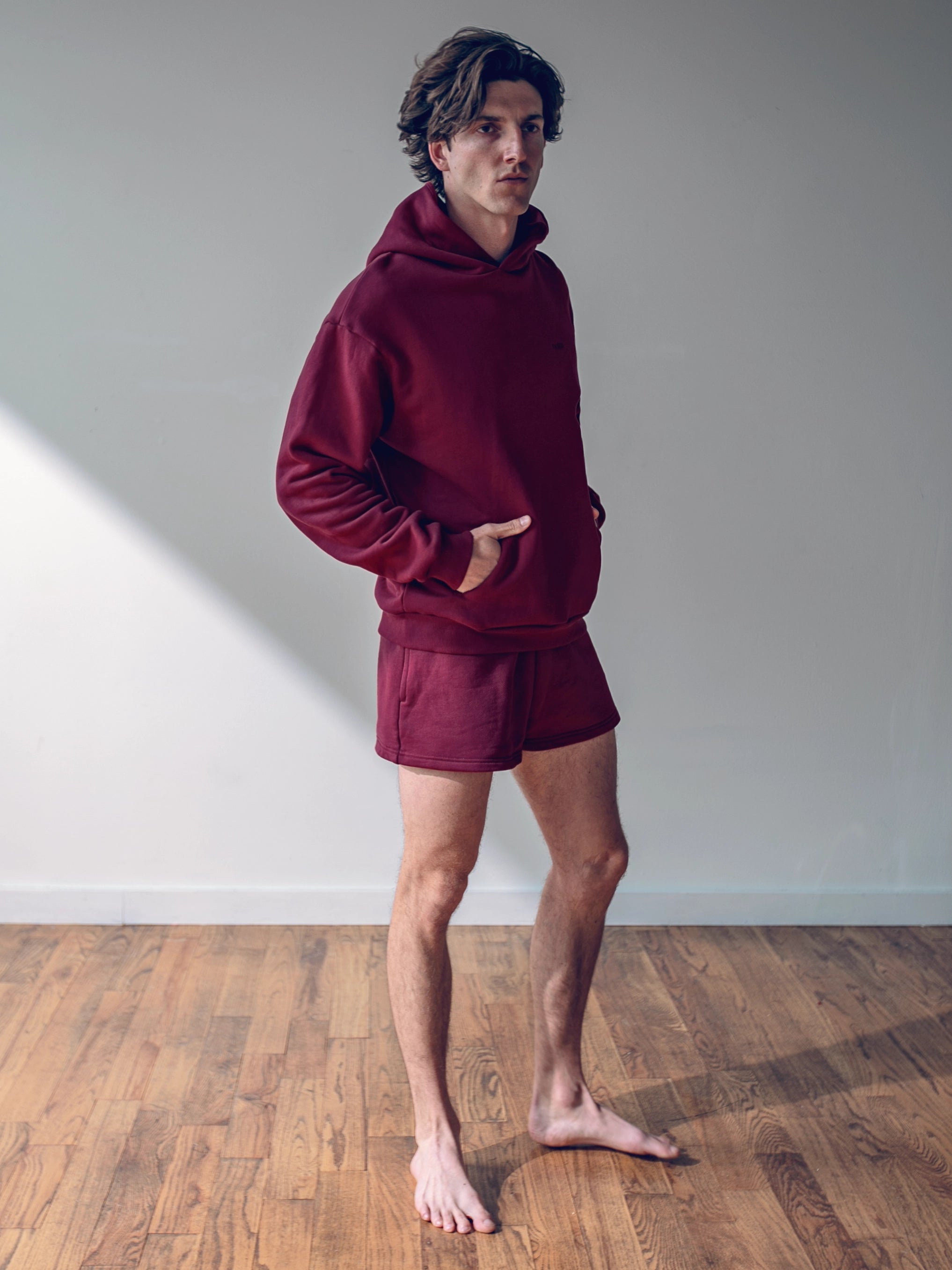 Close-up of a single green leaf against a white background.
