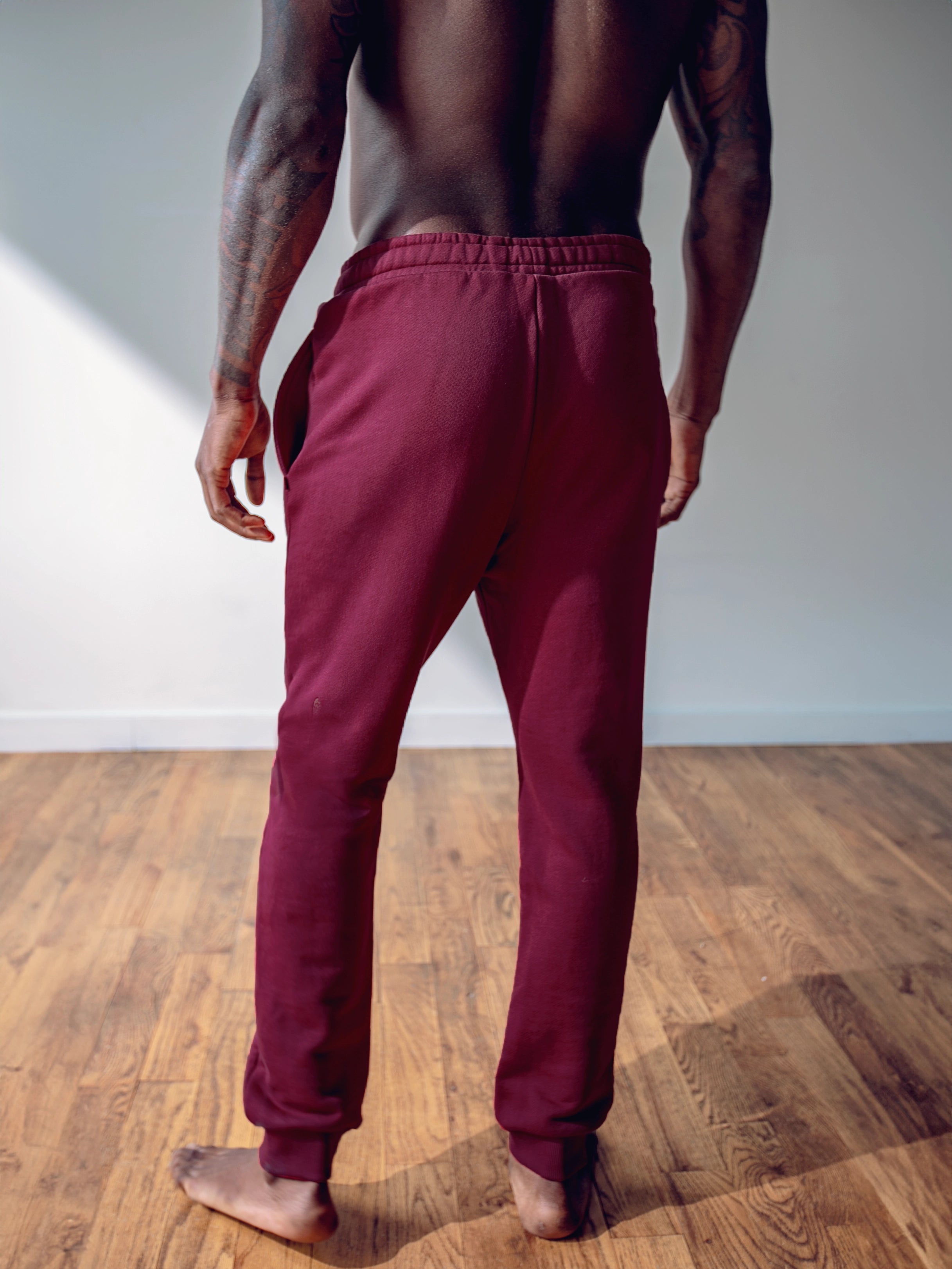 Close-up of a single green leaf against a white background.