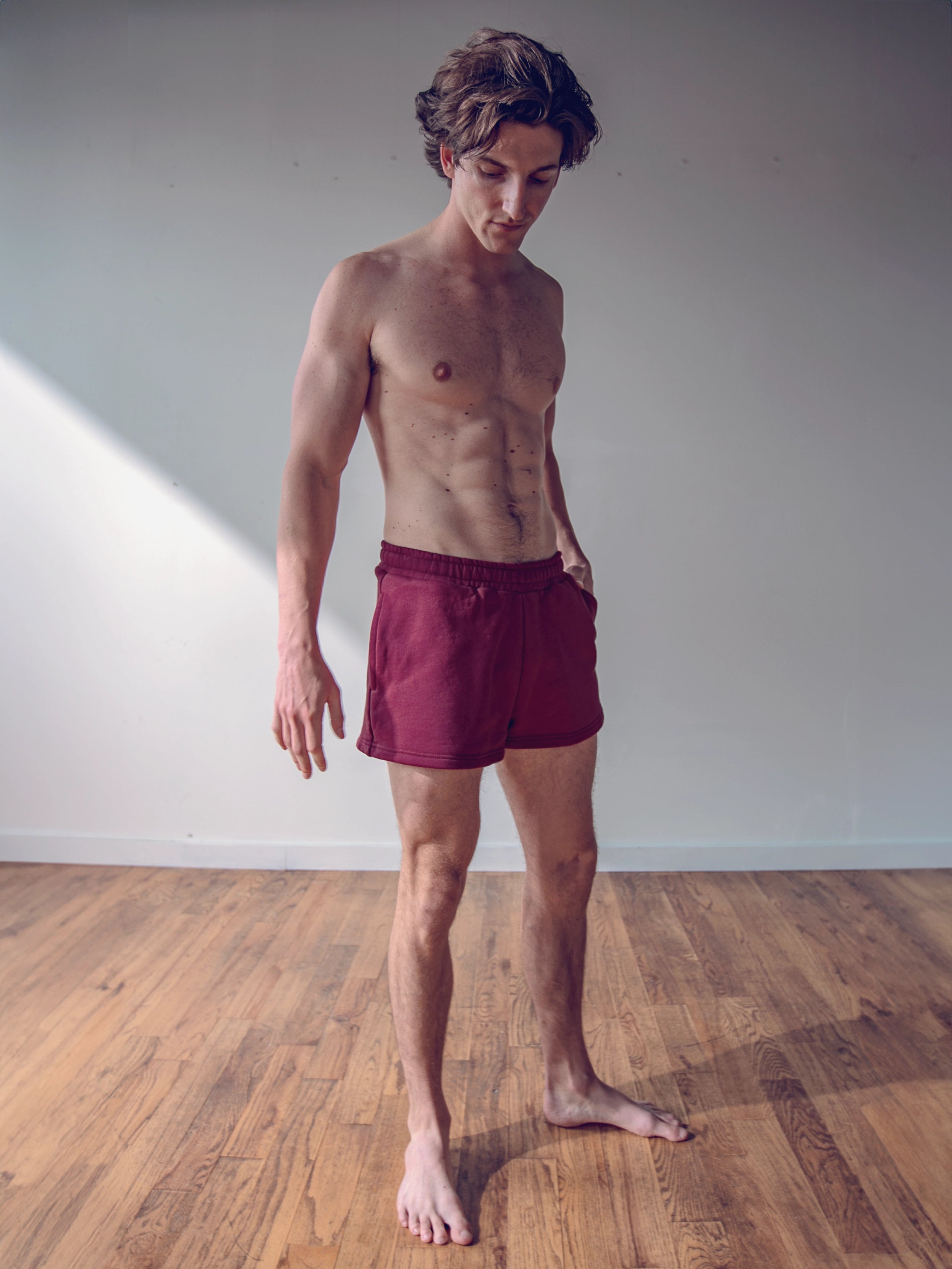 Close-up of a single green leaf against a white background.