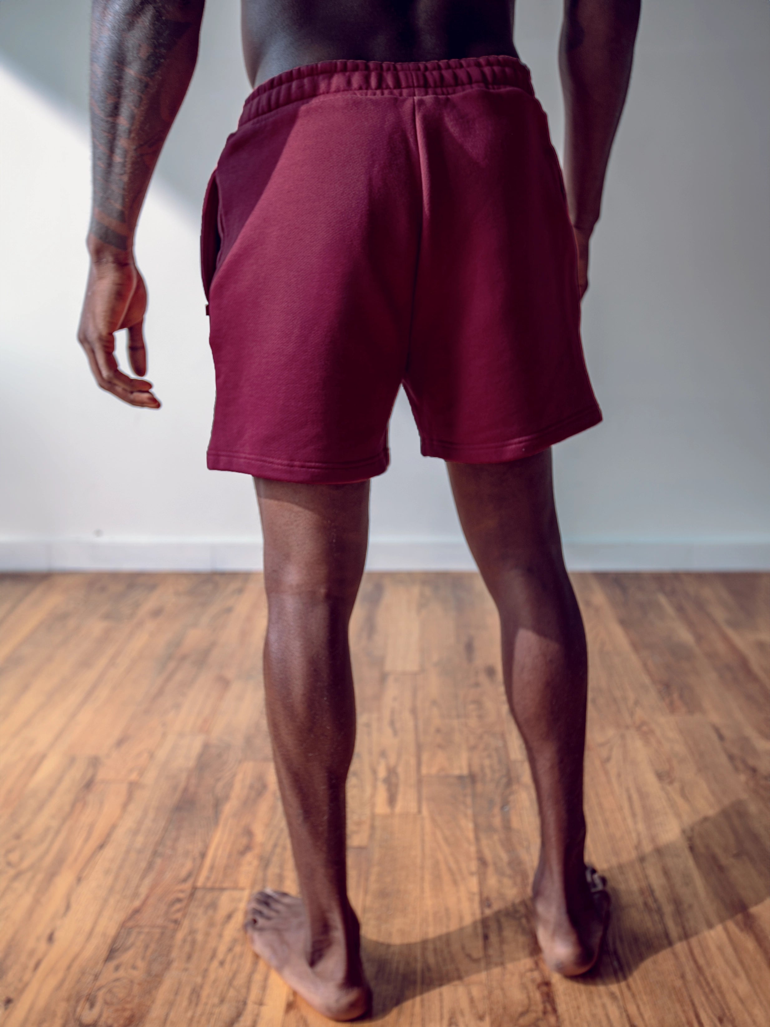 Close-up of a single green leaf against a white background.