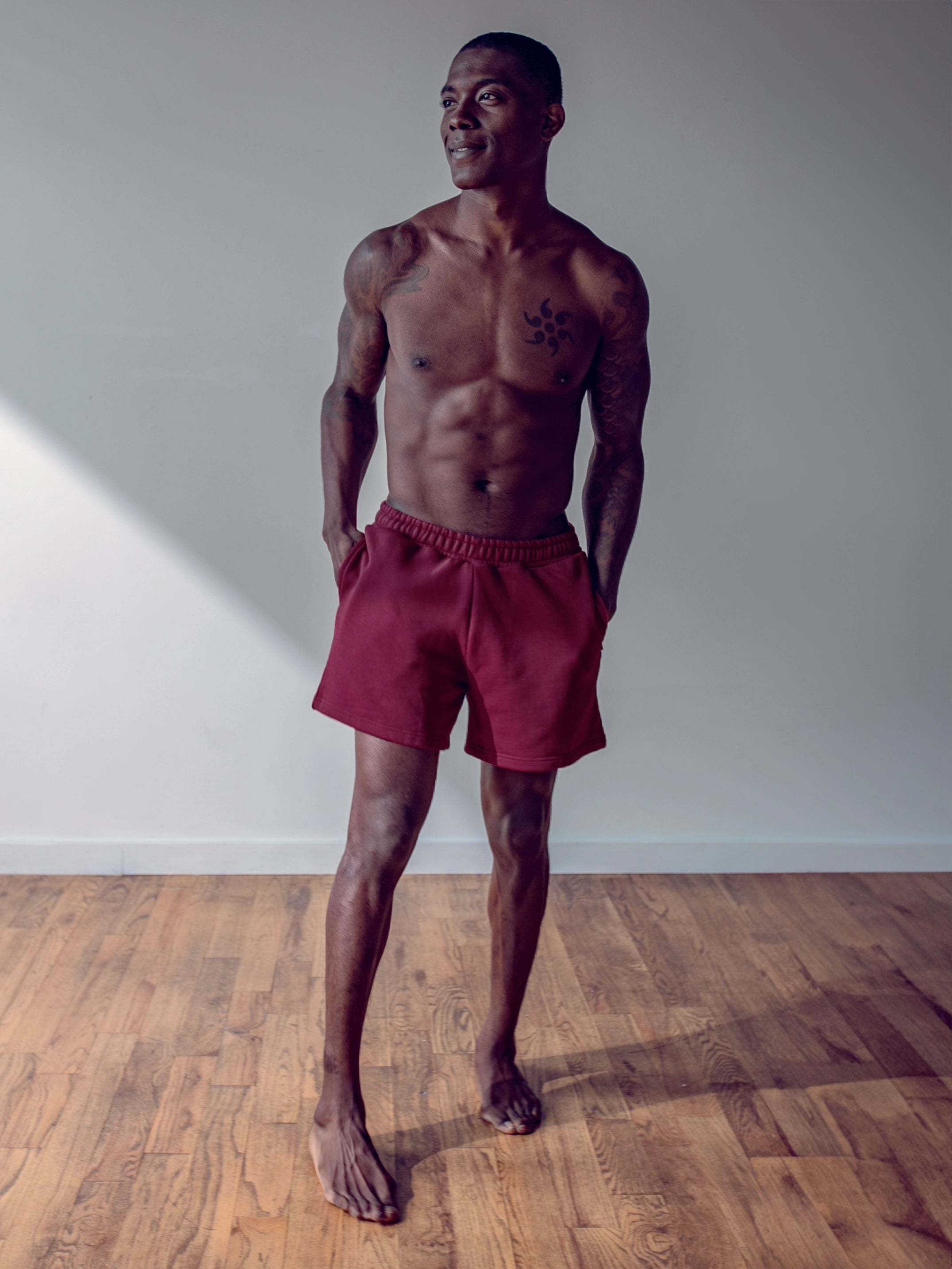 Close-up of a single green leaf against a white background.